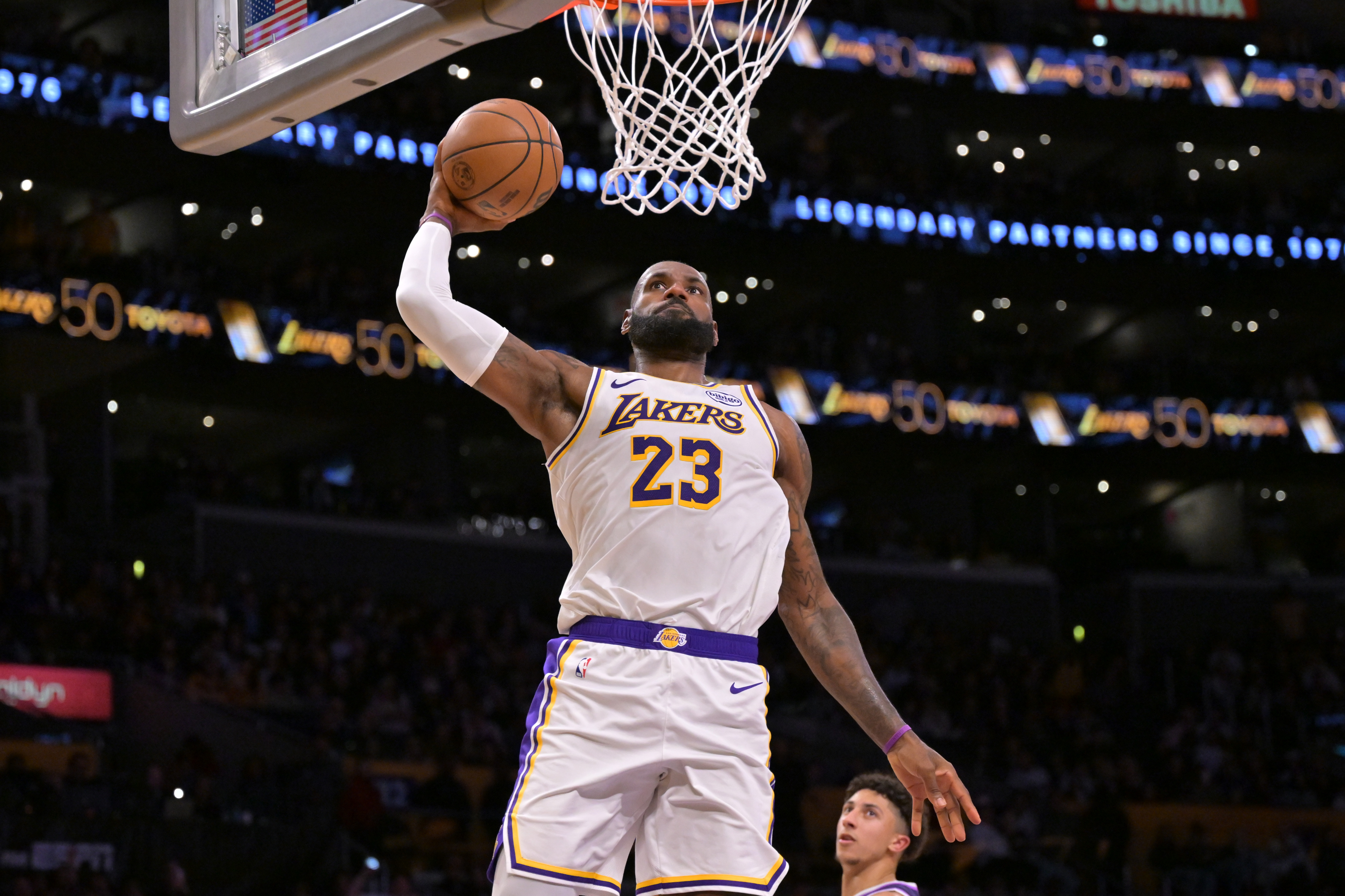 Los Angeles Lakers forward Lebron James (23), seen here dunking, is featured in our NBA player props today.