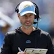 Head Coach Brandon Staley of the Los Angeles Chargers looks at his play call sheet as we look at the NFL playoff odds