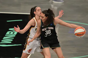 Indiana Fever guard Caitlin Clark (22) defends New York Liberty forward Breanna Stewart (30), as we offer our best Fever vs. Liberty prediction and expert picks for Sunday's WNBA matchup between the Fever vs. Liberty at Barclays Center in Brooklyn, N.Y.