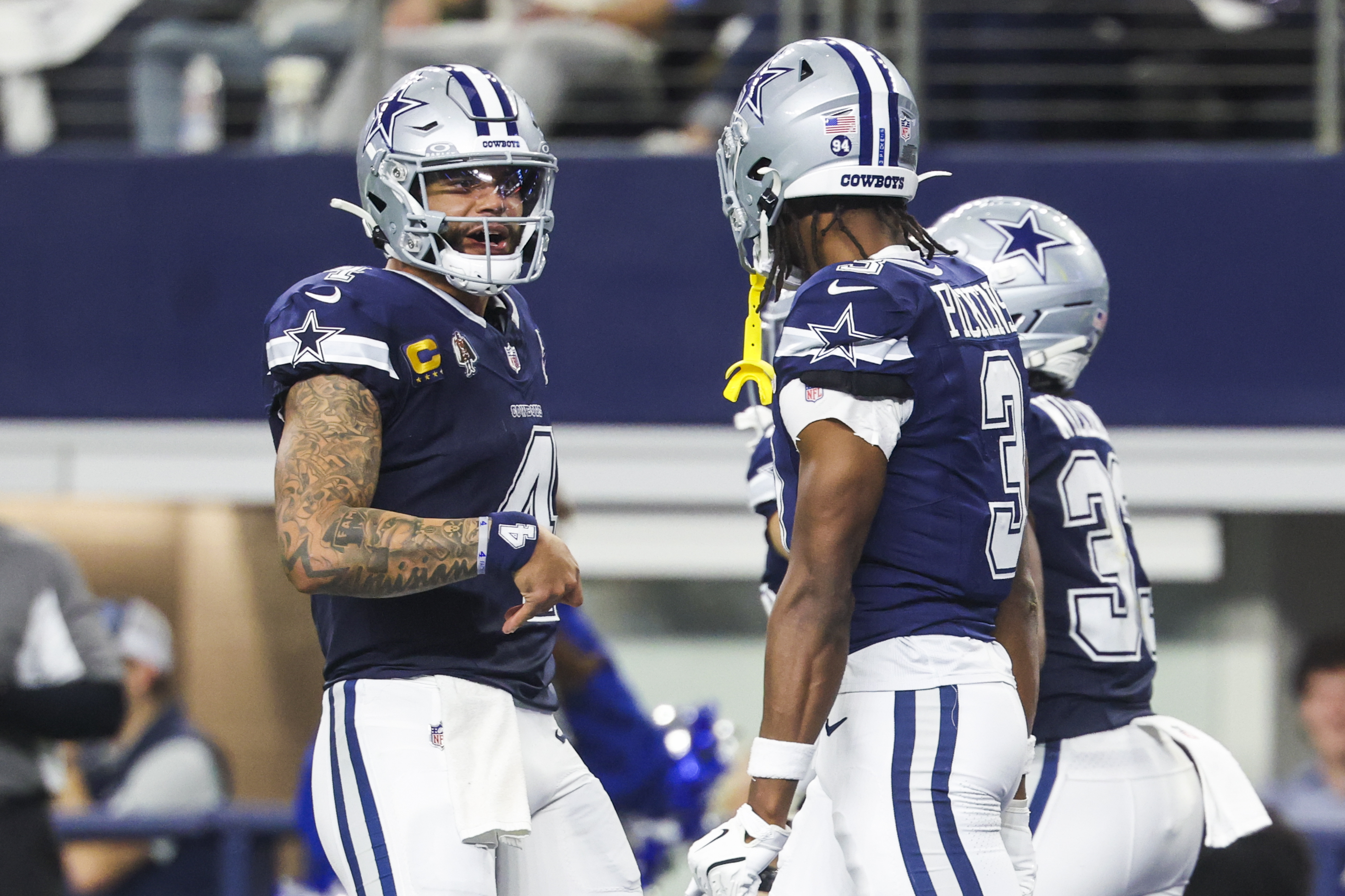 Dallas Cowboys quarterback Dak Prescott (4) celebrates with wide receiver George Pickens (3) as we offer our Cowboys vs. Commanders expert picks for NFL Christmas Day.