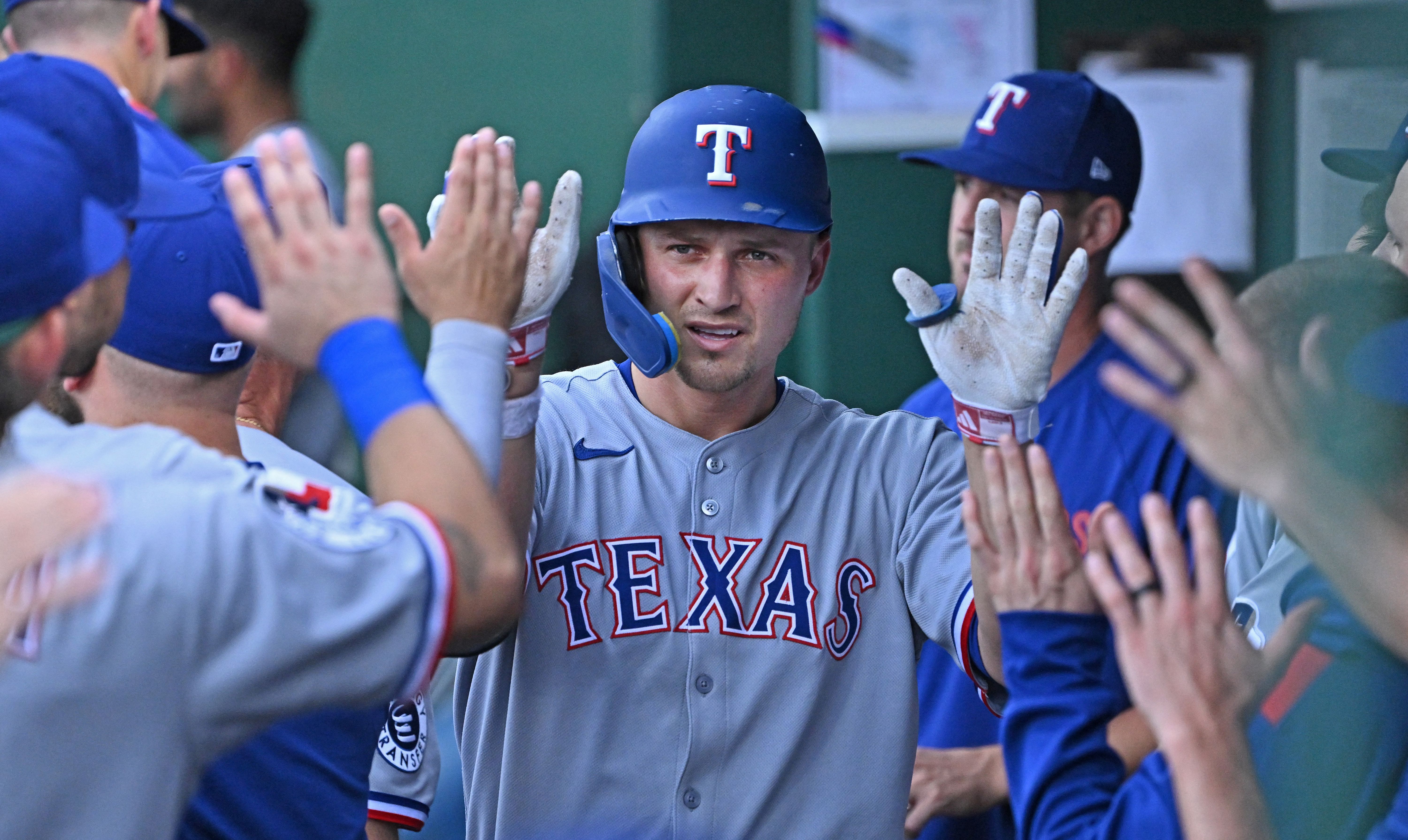 Texas Rangers shortstop Corey Seager celebrates, and he's key as we look at the Rangers vs. Tigers win probability.