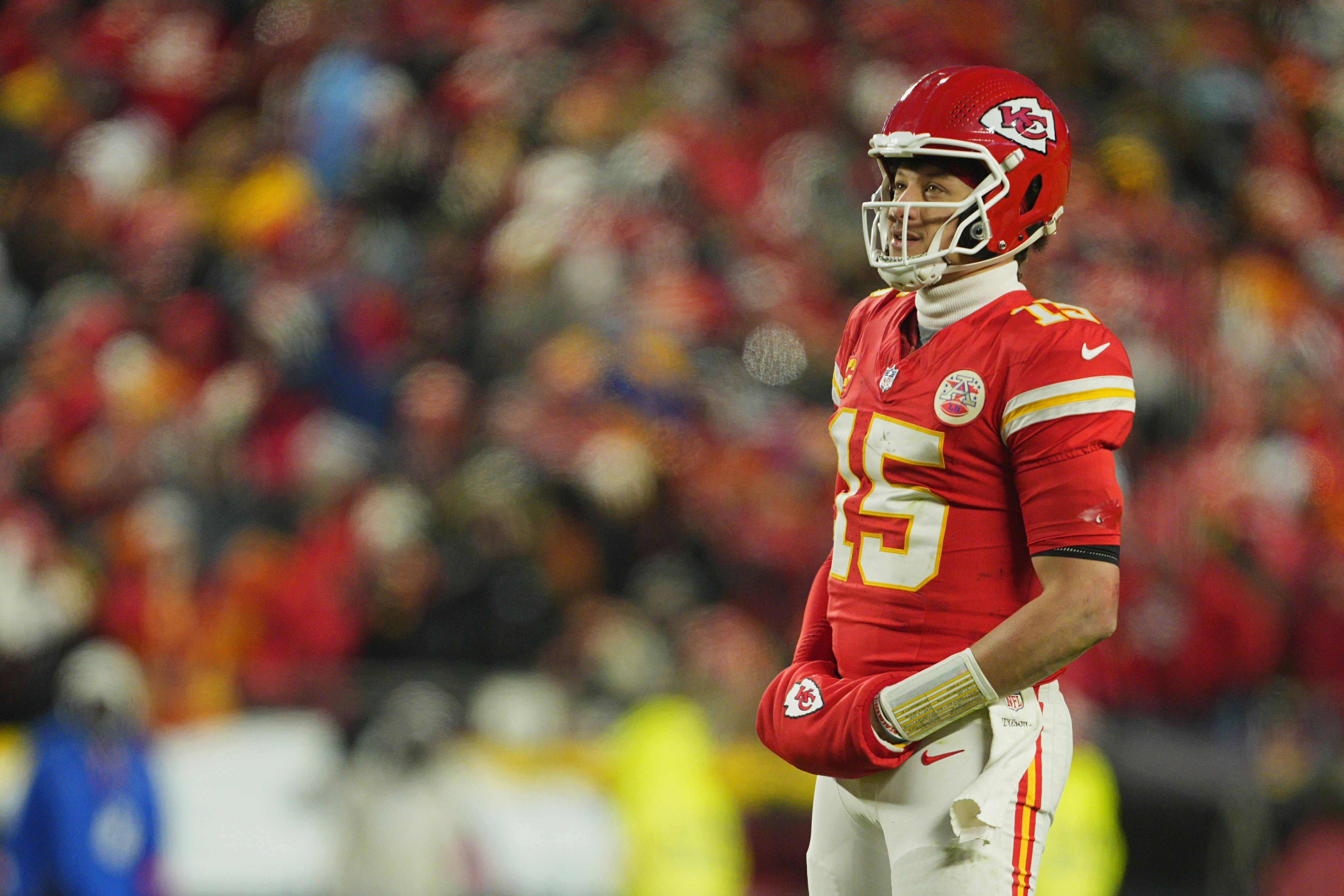 Kansas City Chiefs quarterback Patrick Mahomes looks on as we dive into our Allen vs. Mahomes comparison.