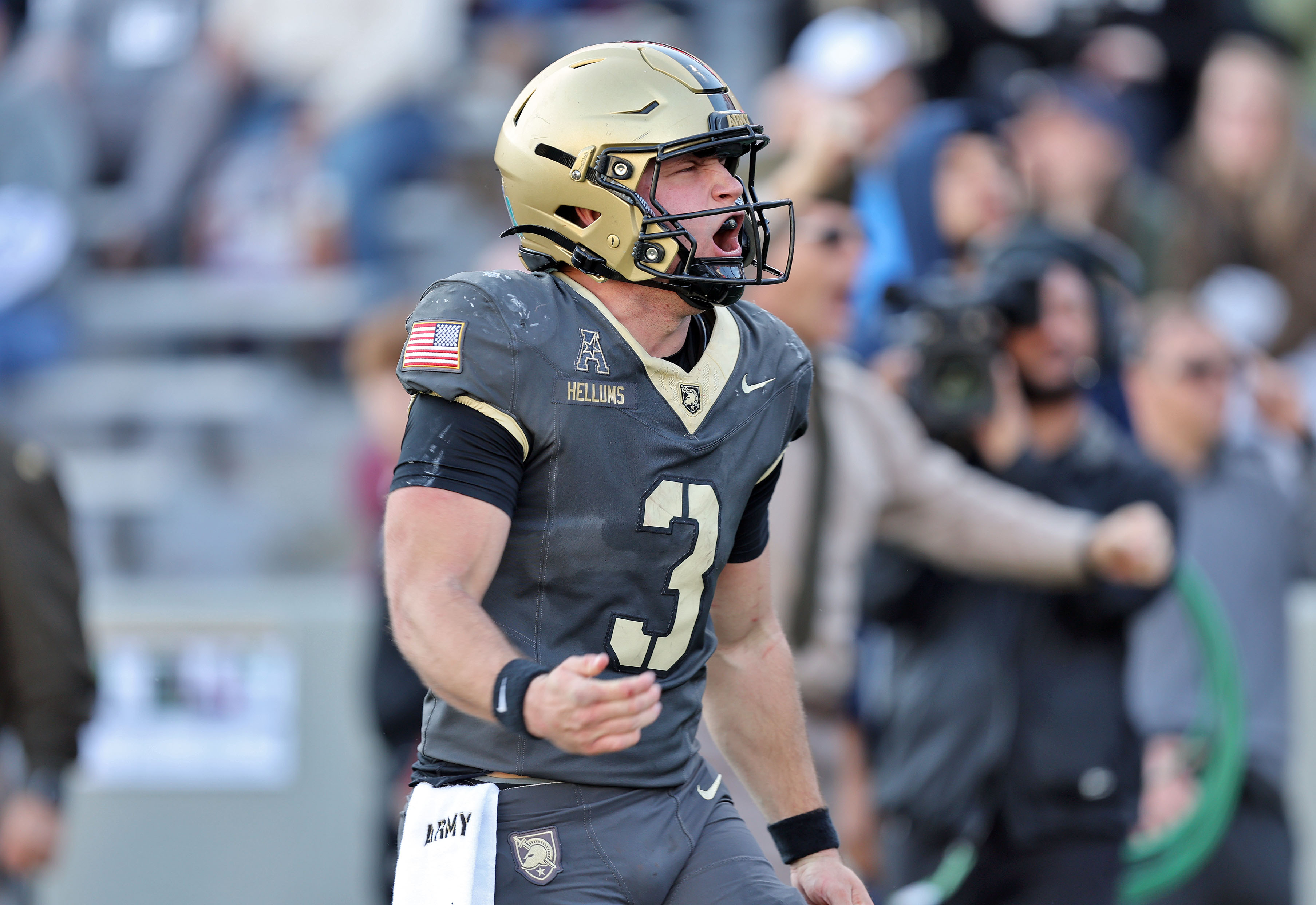 Army quarterback Cale Hellums (3) celebrates as we offer our UConn vs. Army predictions today for the Fenway Bowl.