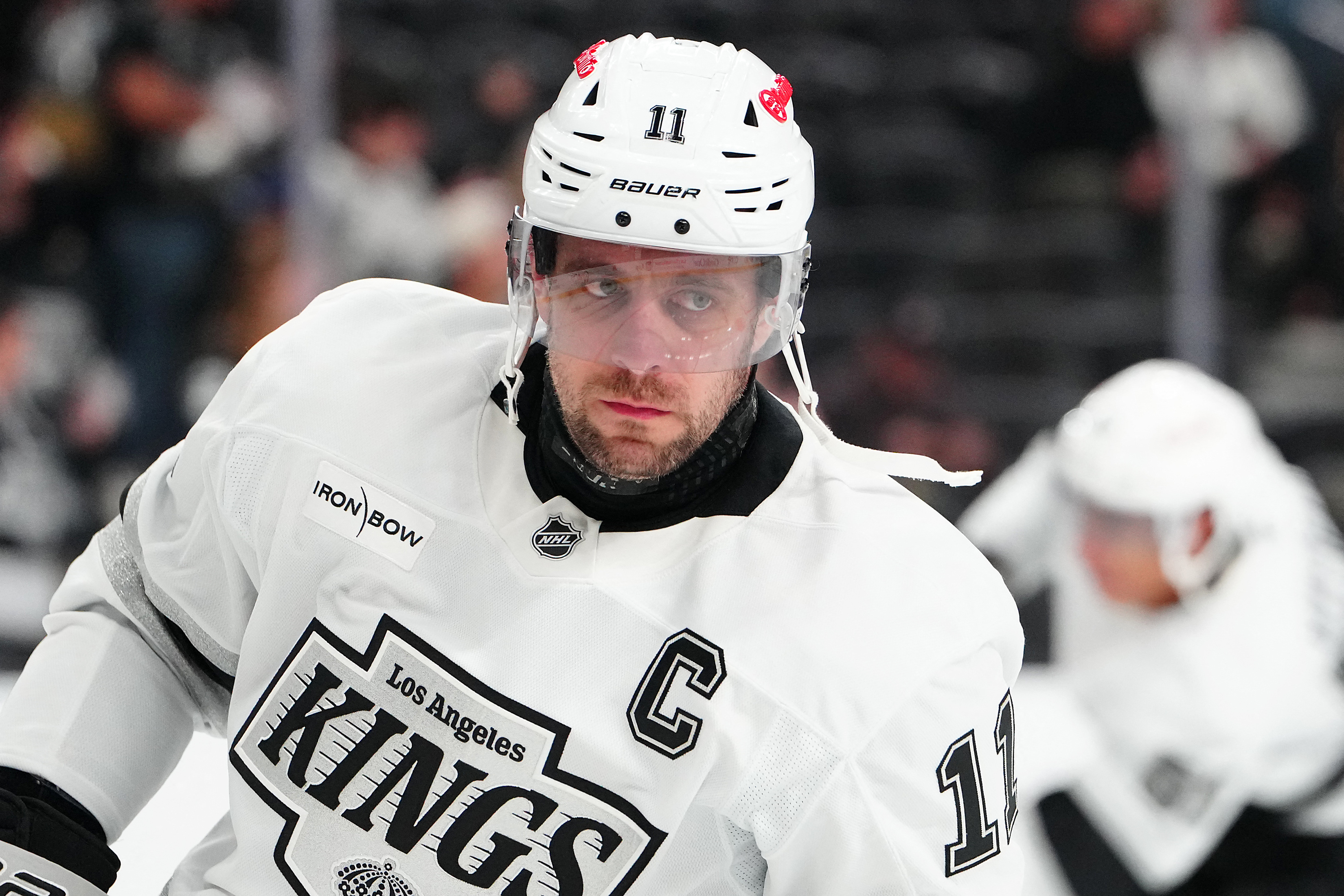 Los Angeles Kings center Anze Kopitar (11) warms up as we break down our Islanders vs. Kings prediction, picks & best bets today.