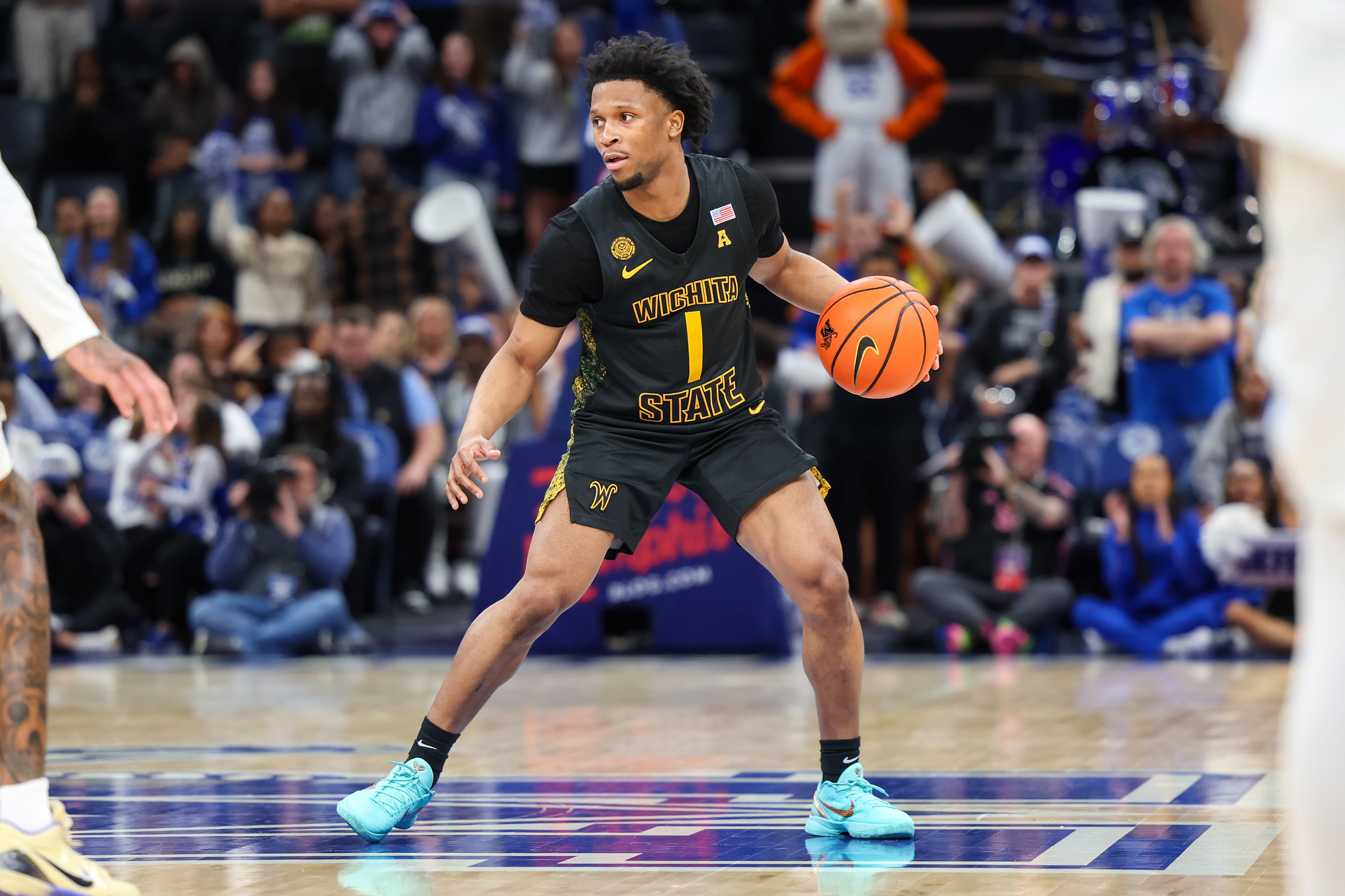 Wichita State Shockers guard Kenyon Giles handles the ball as we make our best Wichita State vs. South Florida American Conference Championship prediction