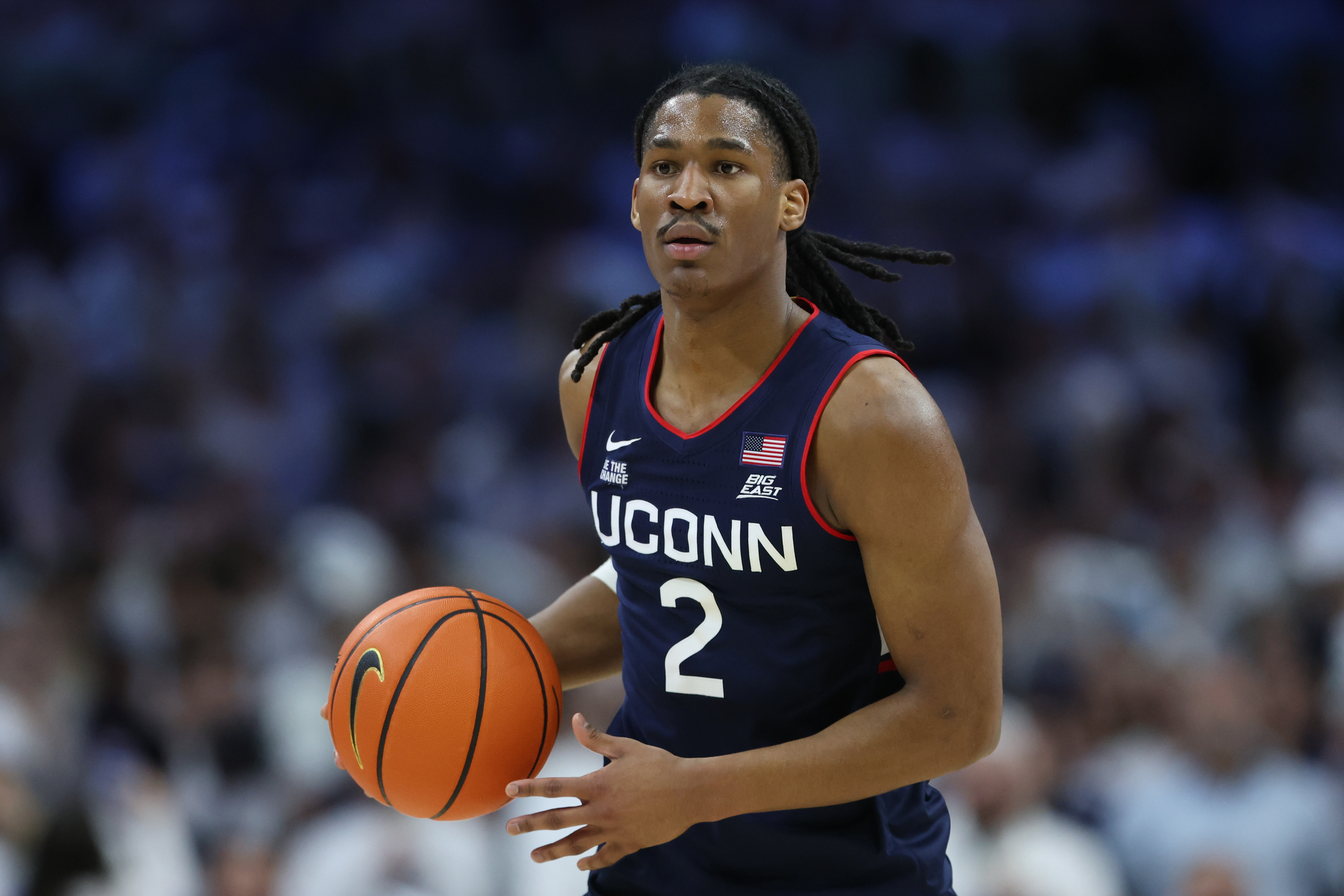UConn Huskies guard Silas Demary Jr. (2) dribbles the ball as we break down our Furman vs. UConn prediction.