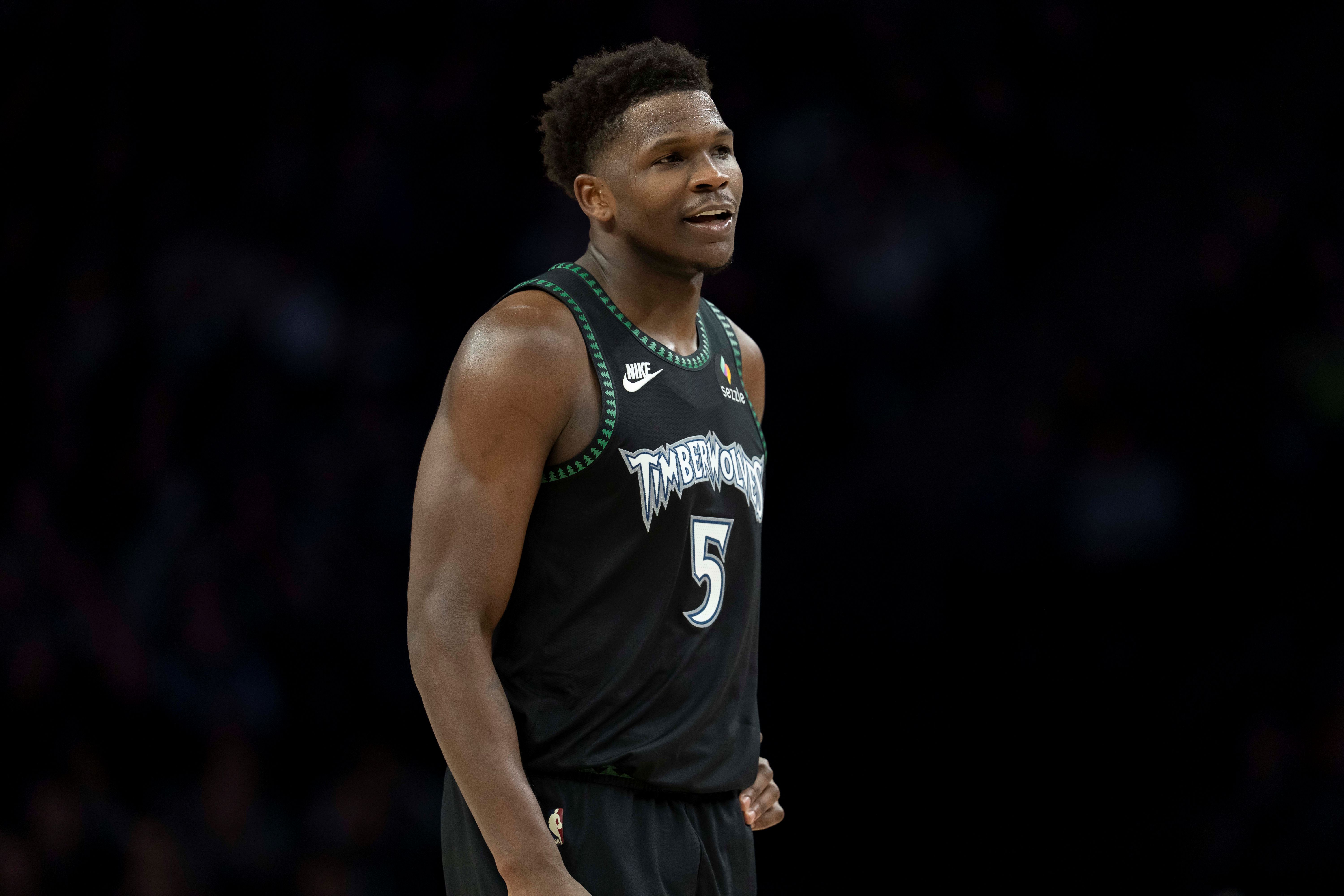 Minnesota Timberwolves guard Anthony Edwards (5), seen here looking on, is featured in our NBA Clutch Player of the Year odds.