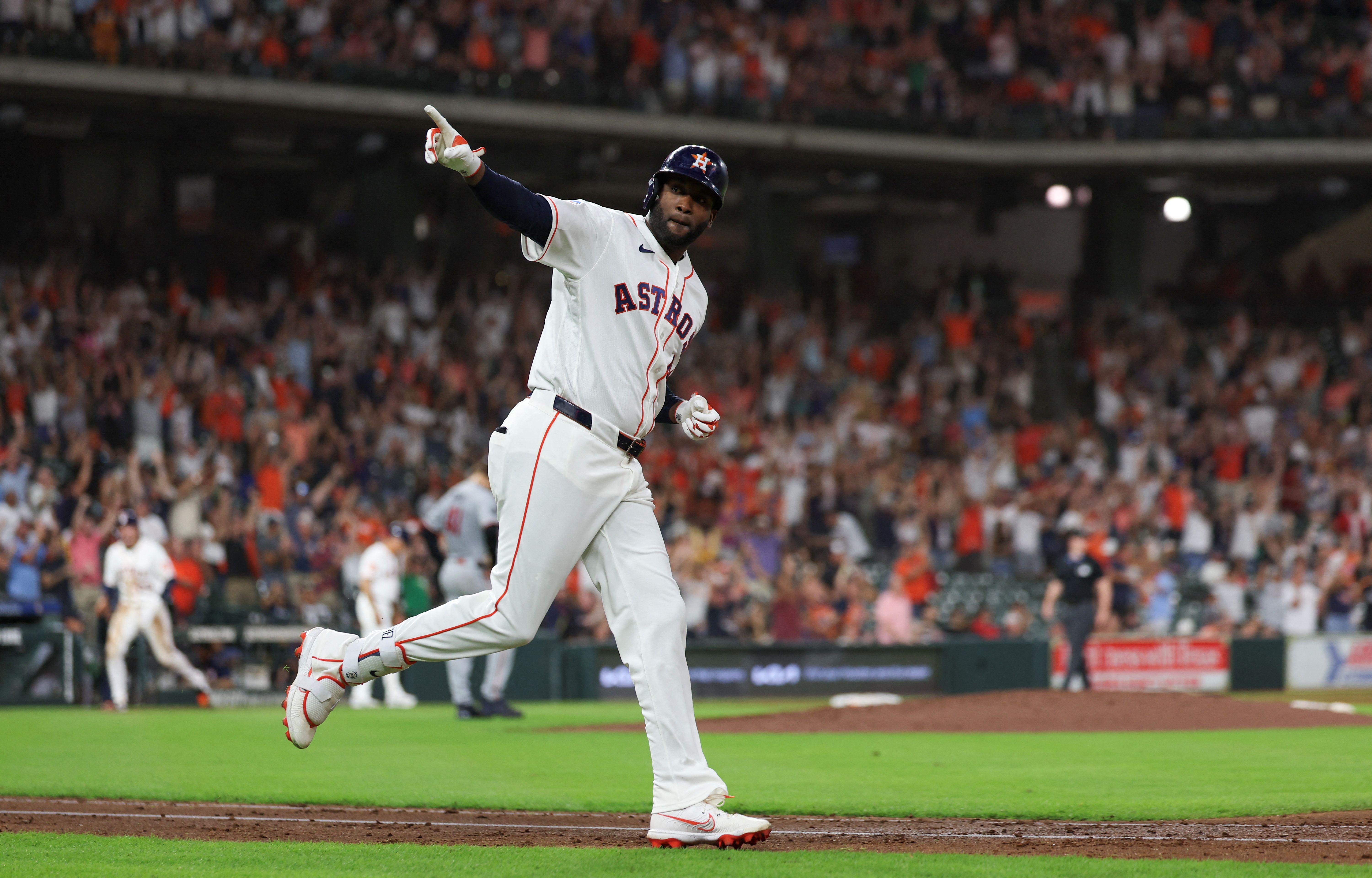 Houston Astros left fielder Yordan Alvarez reacts after hitting a grand slam, and he's featured in the MVP odds.