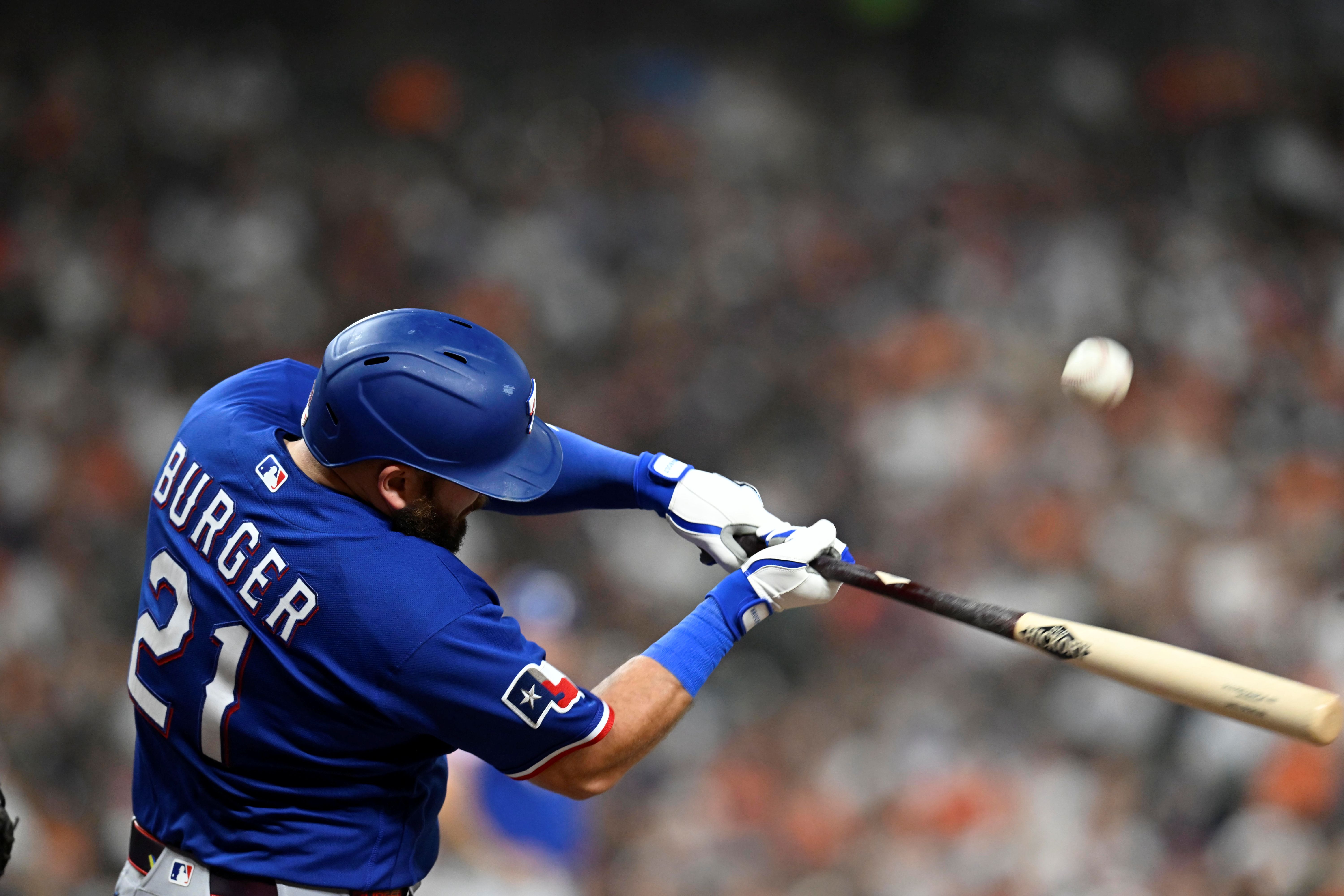 Texas Rangers first baseman Jake Burger at bat as we make our best home run predictions today.