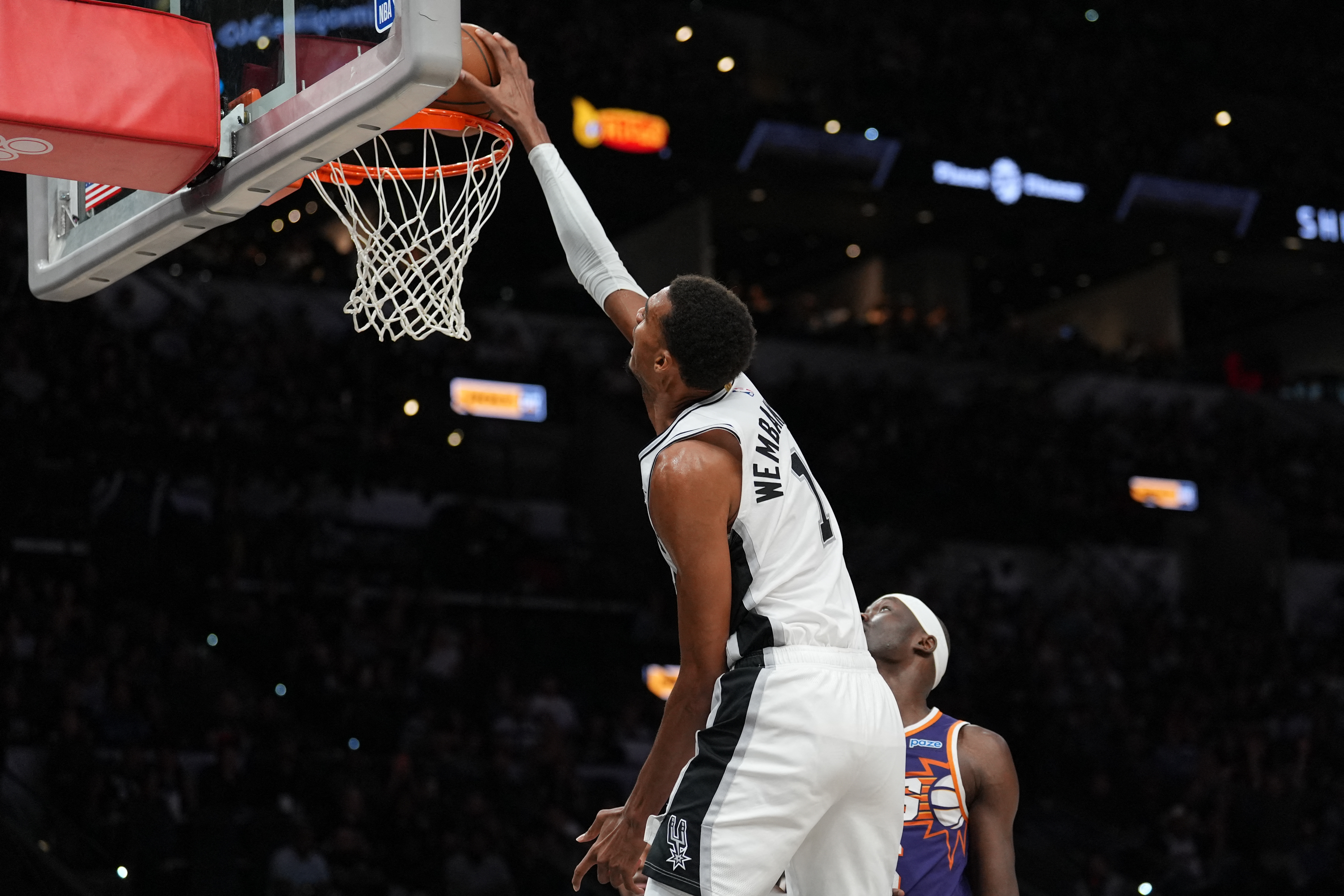 San Antonio Spurs forward Victor Wembanyama (1) reaches for a dunk in the first half against the Phoenix Suns as we take a closer look at the odds for the NBA MVP.