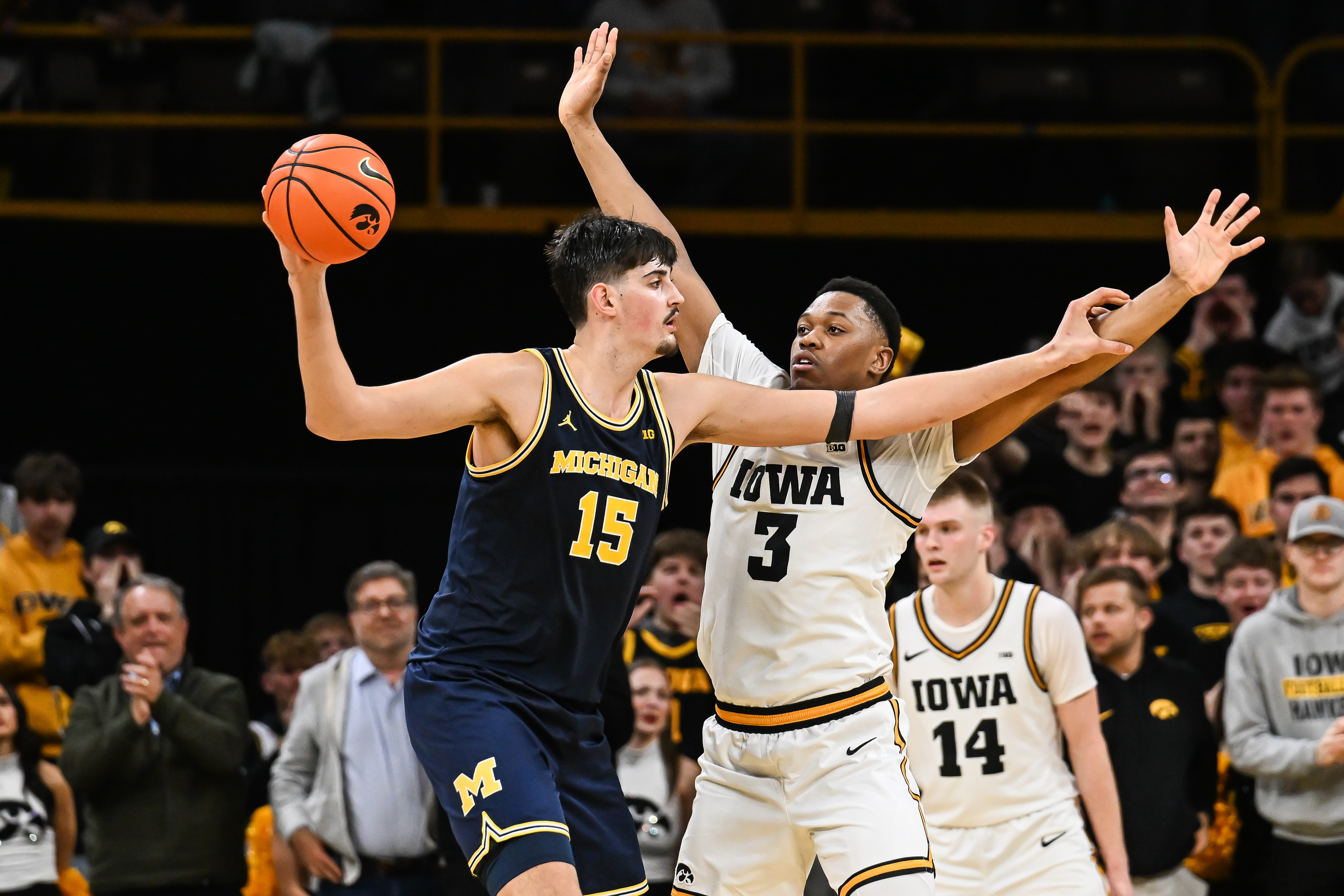 Michigan Wolverines center Aday Mara (15) controls the ball as we look at our college basketball predictions today