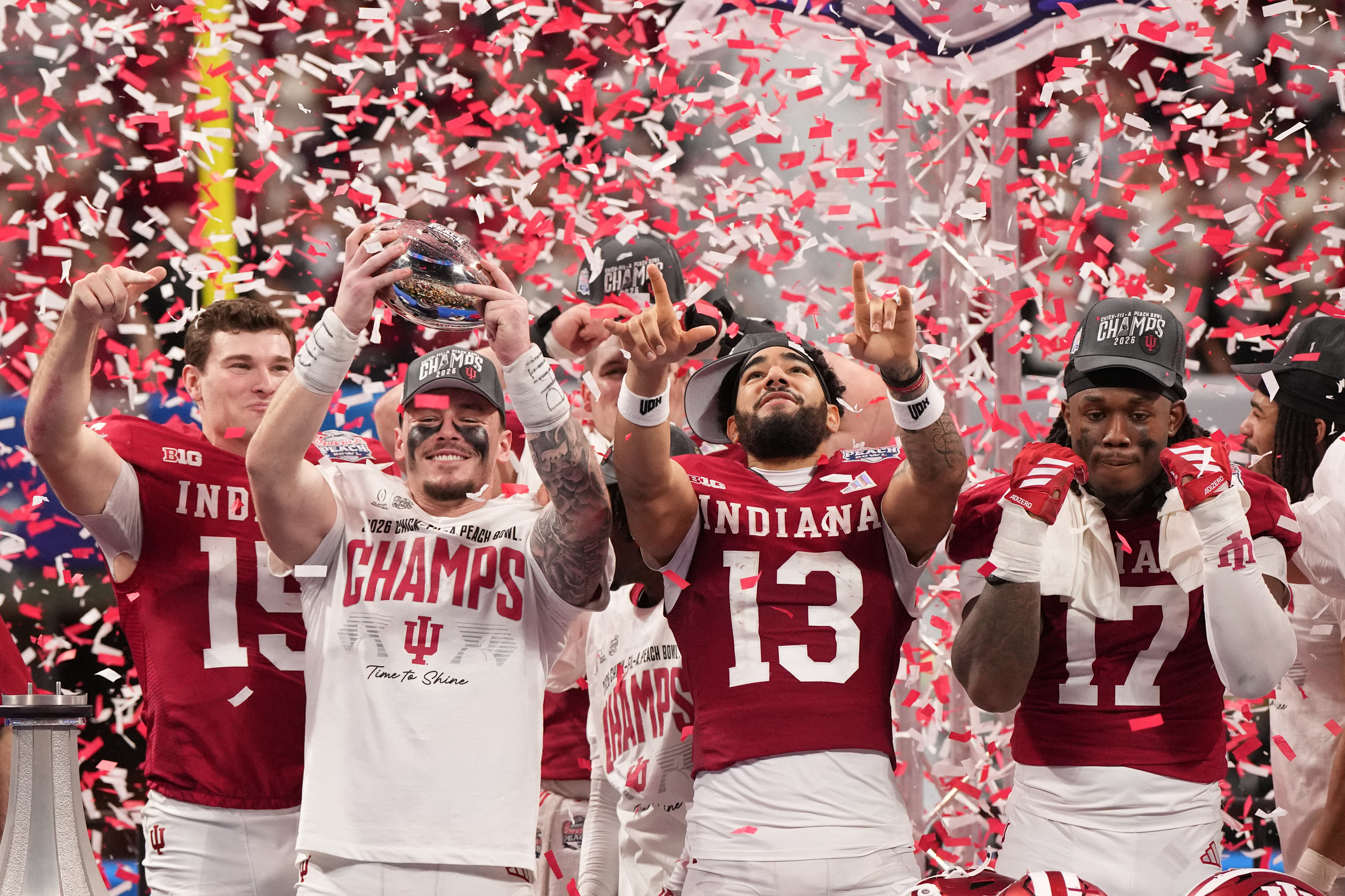 Indiana Hoosiers linebacker Aiden Fisher (4) raises the trophy with quarterback Fernando Mendoza (15), wide receiver Elijah Sarratt (13), and defensive lineman Daniel Ndukwe (17) as we break down our Miami vs. Indiana expert picks and best bets for the 20