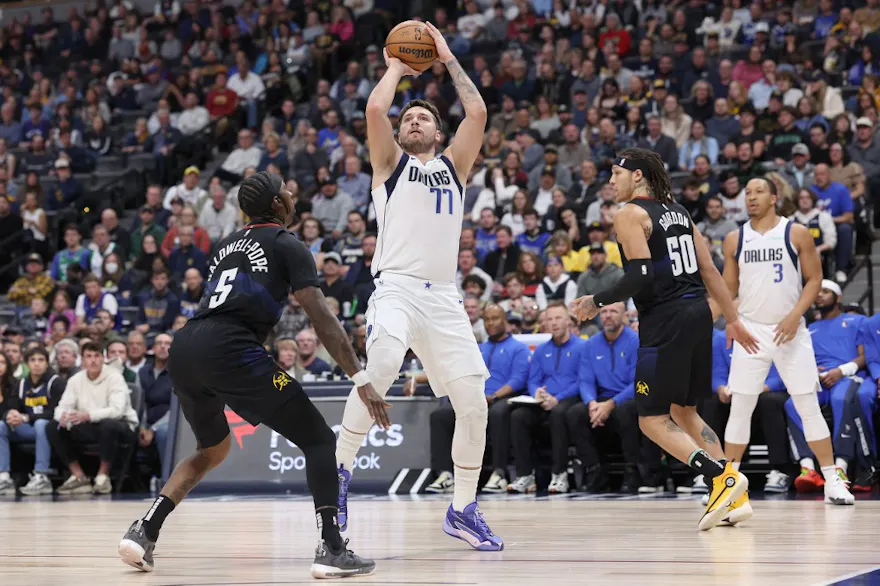 Luka Doncic #77 of the Dallas Mavericks puts up a shot as we look at our NBA predictions for Christmas Day