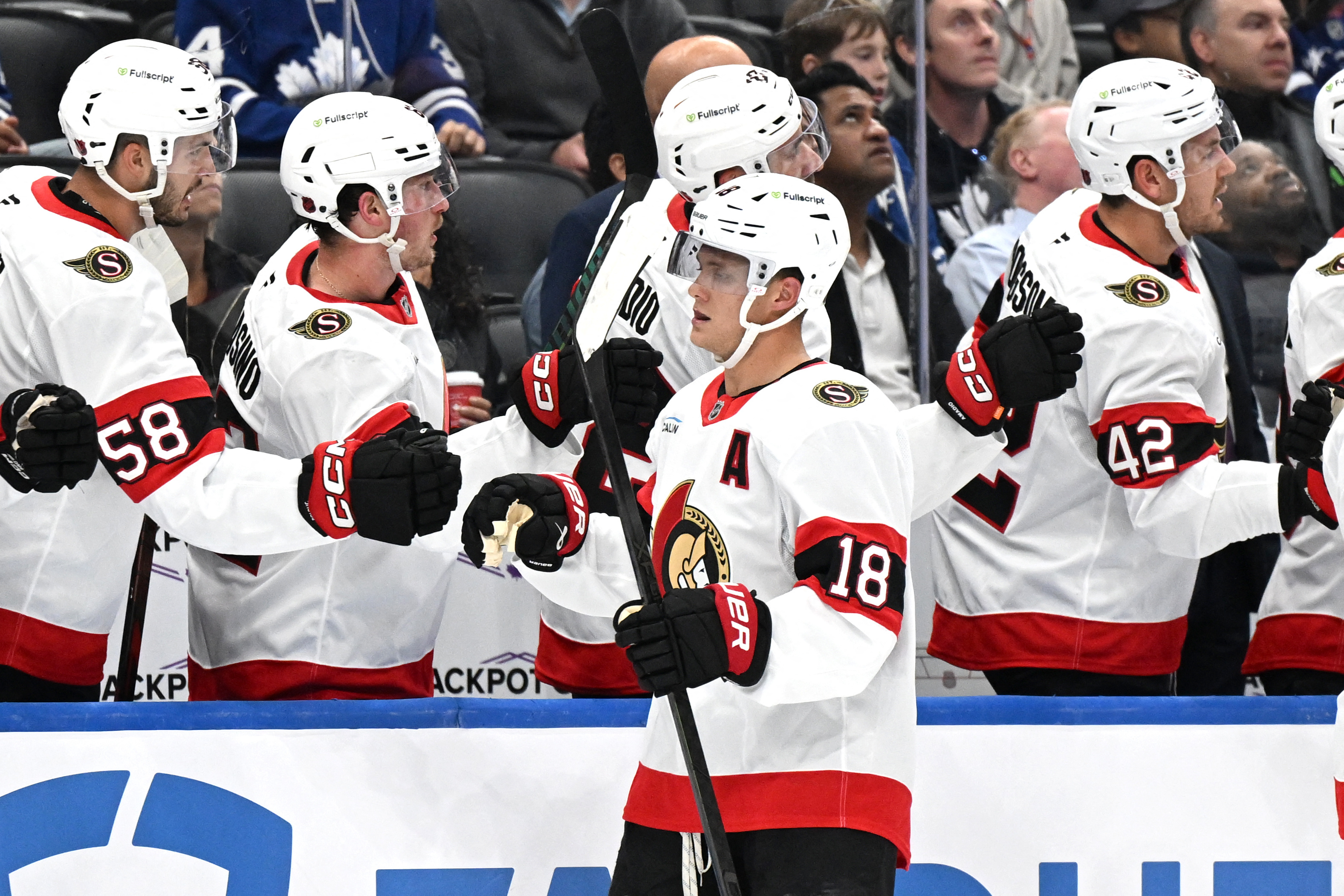 Senators forward Tim Stutzle (18) celebrates as we break down our NHL predictions today.