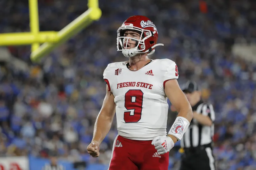 Jake Haener of the Fresno State Bulldogs celebrates a touchdown against the UCLA Bruins during the second half at Rose Bowl in Pasadena, California.  Photo by Michael Owens/Getty Images via AFP.