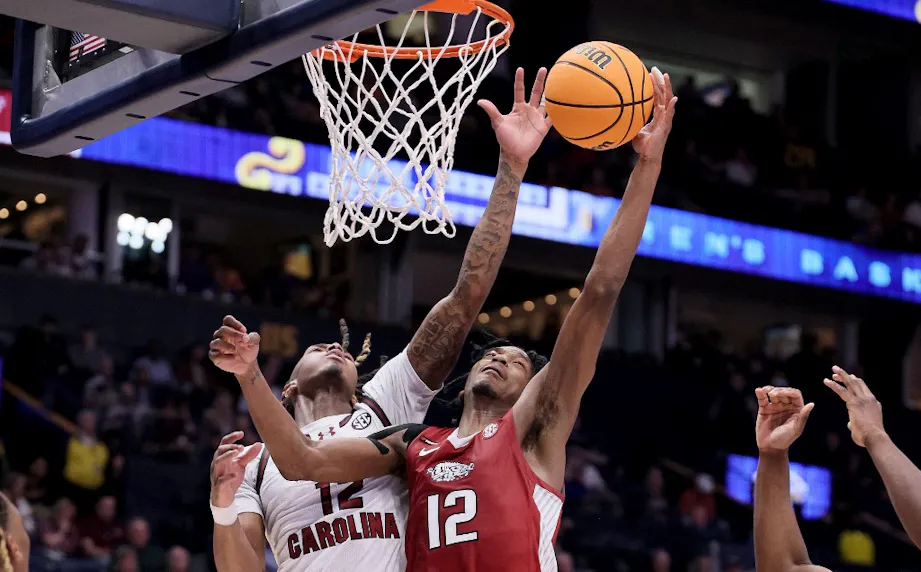 South Carolina Gamecocks' Zachary Davis and Arkansa Razorbacks' Tramon Mark reach for a rebound in the first half as as we make our Oregons vs. South Carolina March Madness prediction.