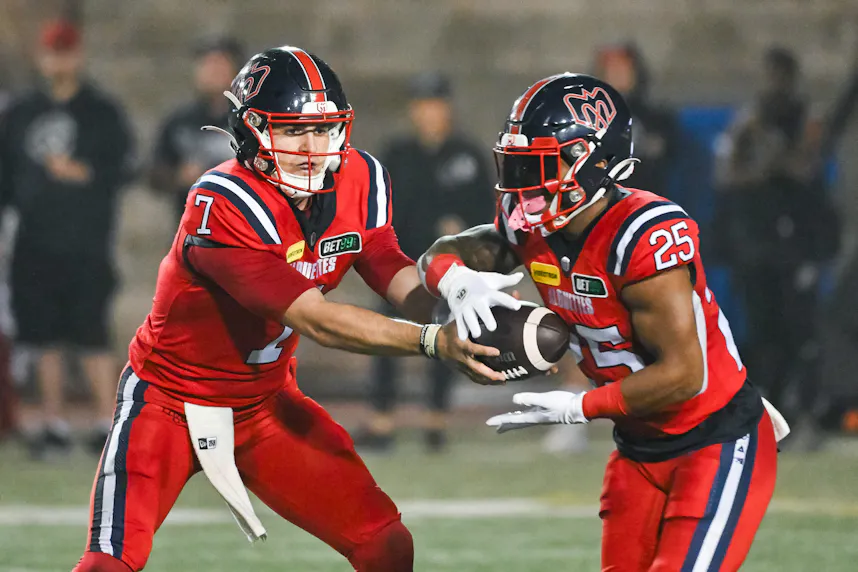 Montreal Alouettes quarterback Cody Fajardo hands the ball off to running back Walter Fletcher. We're backing Montreal in our Alouettes vs. Argonauts prediction.