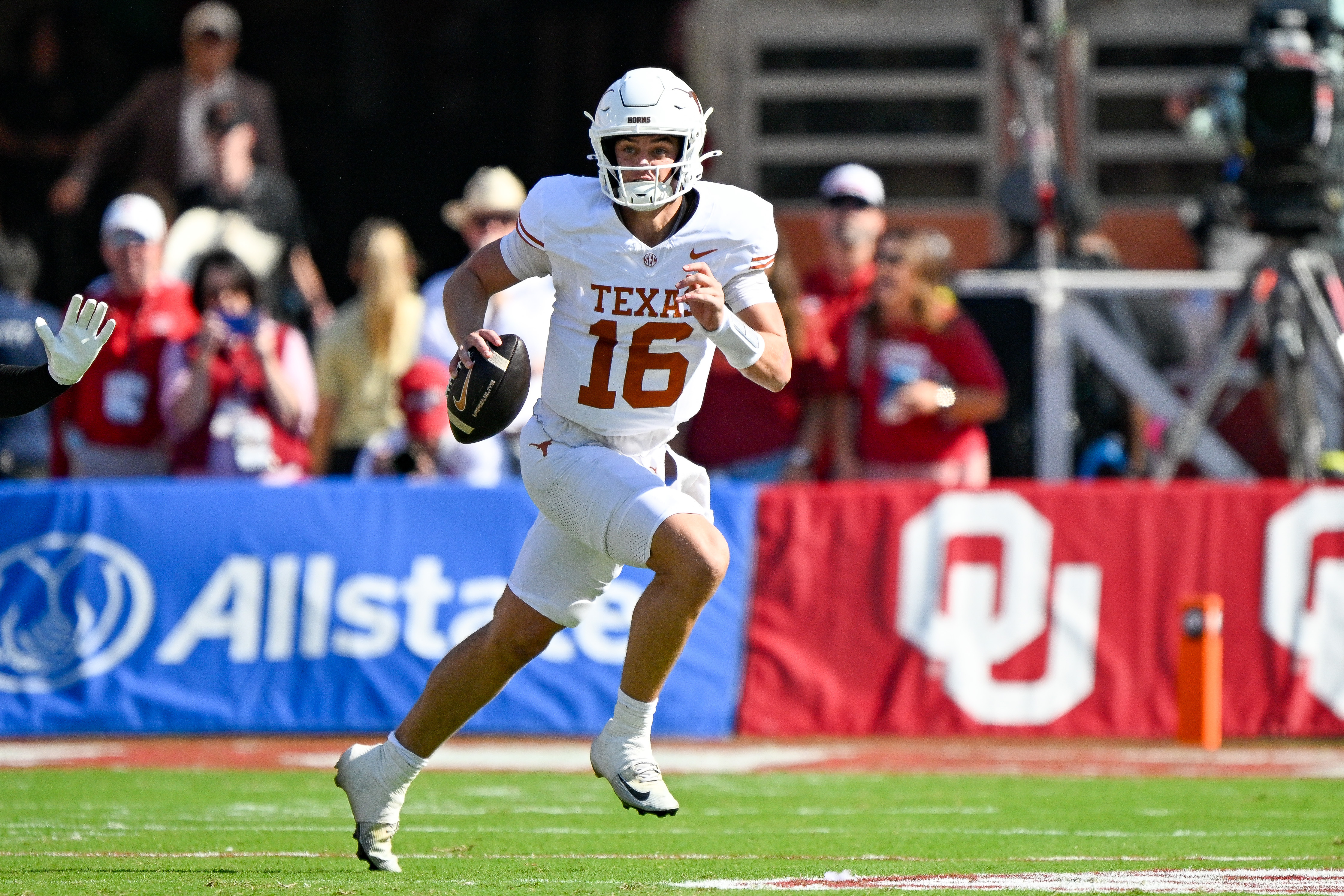 Texas Longhorns quarterback Arch Manning (16) runs with the ball as we make our best NCAAF Week 7 picks against the spread.