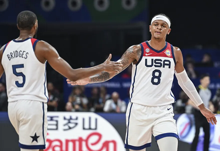 Mikal Bridges and Paolo Banchero react during the FIBA Basketball World Cup Group C match between the USA and New Zealand as we look at our USA-Jordan Caesars promo code.
