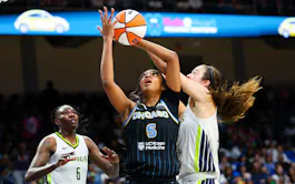 Chicago Sky forward Angel Reese (5) and Dallas Wings forward Maddy Siegrist (20) go for the ball, as we offer our best Wings vs. Sky prediction and expert picks for Thursday's WNBA matchup at Wintrust Arena in Chicago.