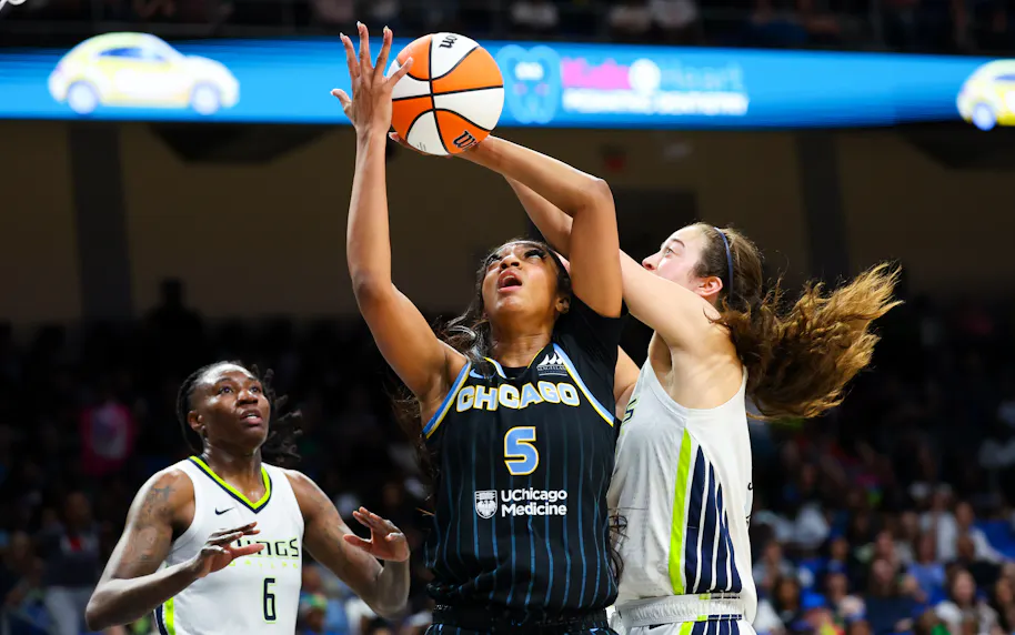 Chicago Sky forward Angel Reese (5) and Dallas Wings forward Maddy Siegrist (20) go for the ball, as we offer our best Wings vs. Sky prediction and expert picks for Thursday's WNBA matchup at Wintrust Arena in Chicago.