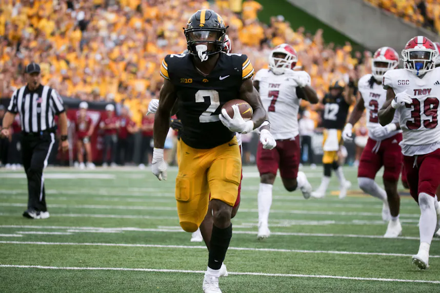 Iowa’s Kaleb Johnson runs the ball to the end zone against Troy as we look at our college football predictions and best bets.