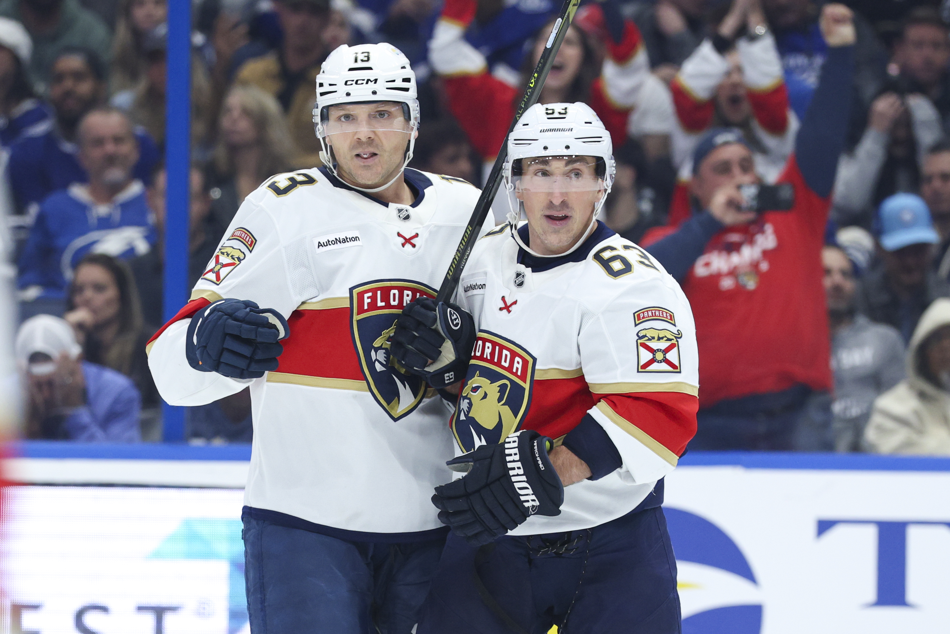 Florida Panthers left wing Brad Marchand (63) reacts to a goal scored by center Sam Reinhart (13), and both are featured in our Rangers vs. Panthers player props.