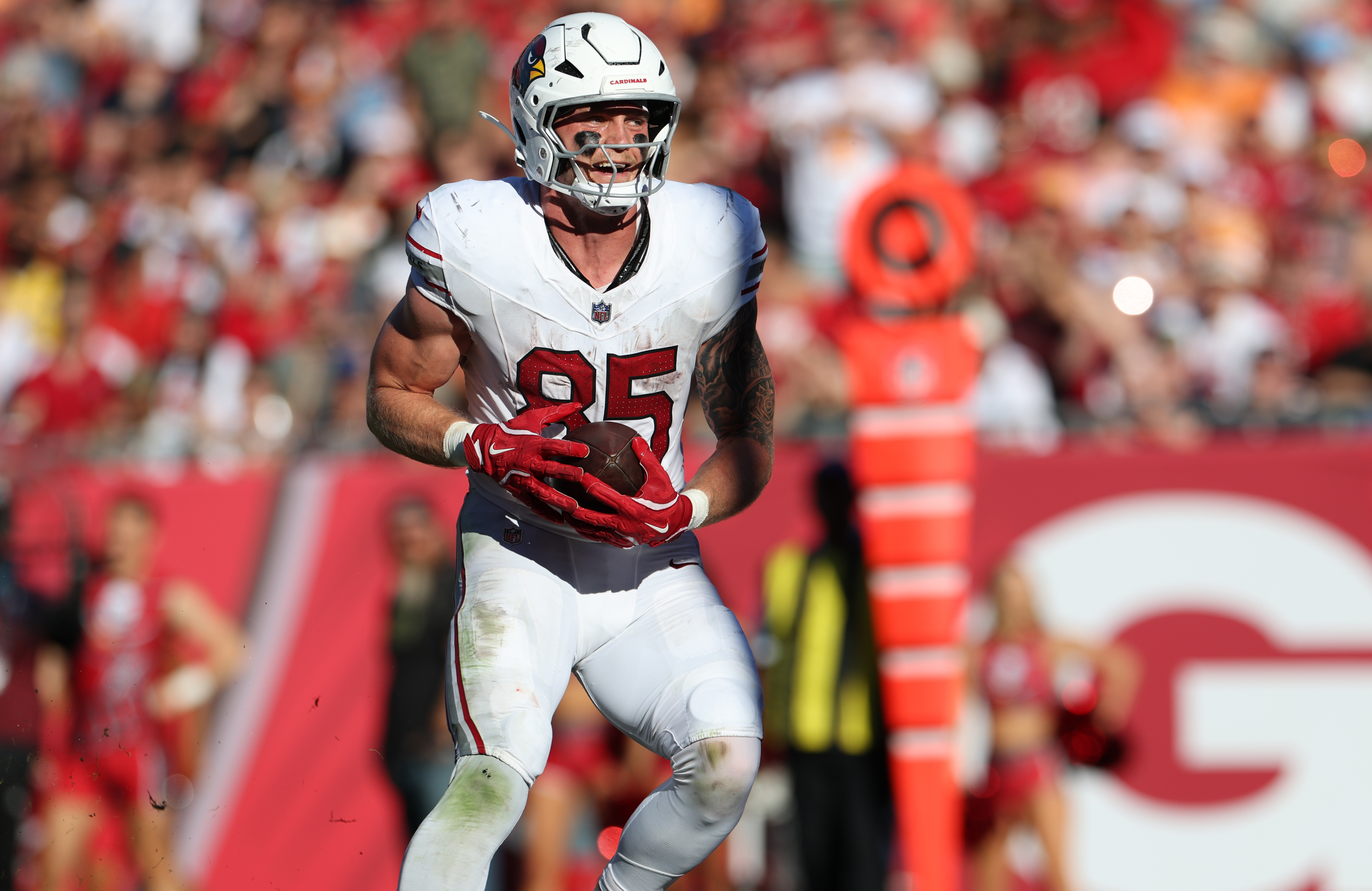 Arizona Cardinals tight end Trey McBride (85) catches a touchdown as he is featured in our NFL best bets for Week 17.