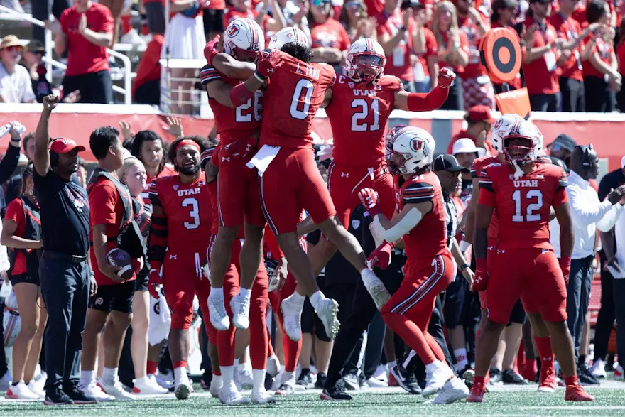 Logan Fano of the Utah Utes celebrates a fumble recovery with teammates Sione Vaki and Karene Reid against the Weber State Wildcats, and we offer our exclusive BetMGM bonus code for Utah vs. Oregon State.