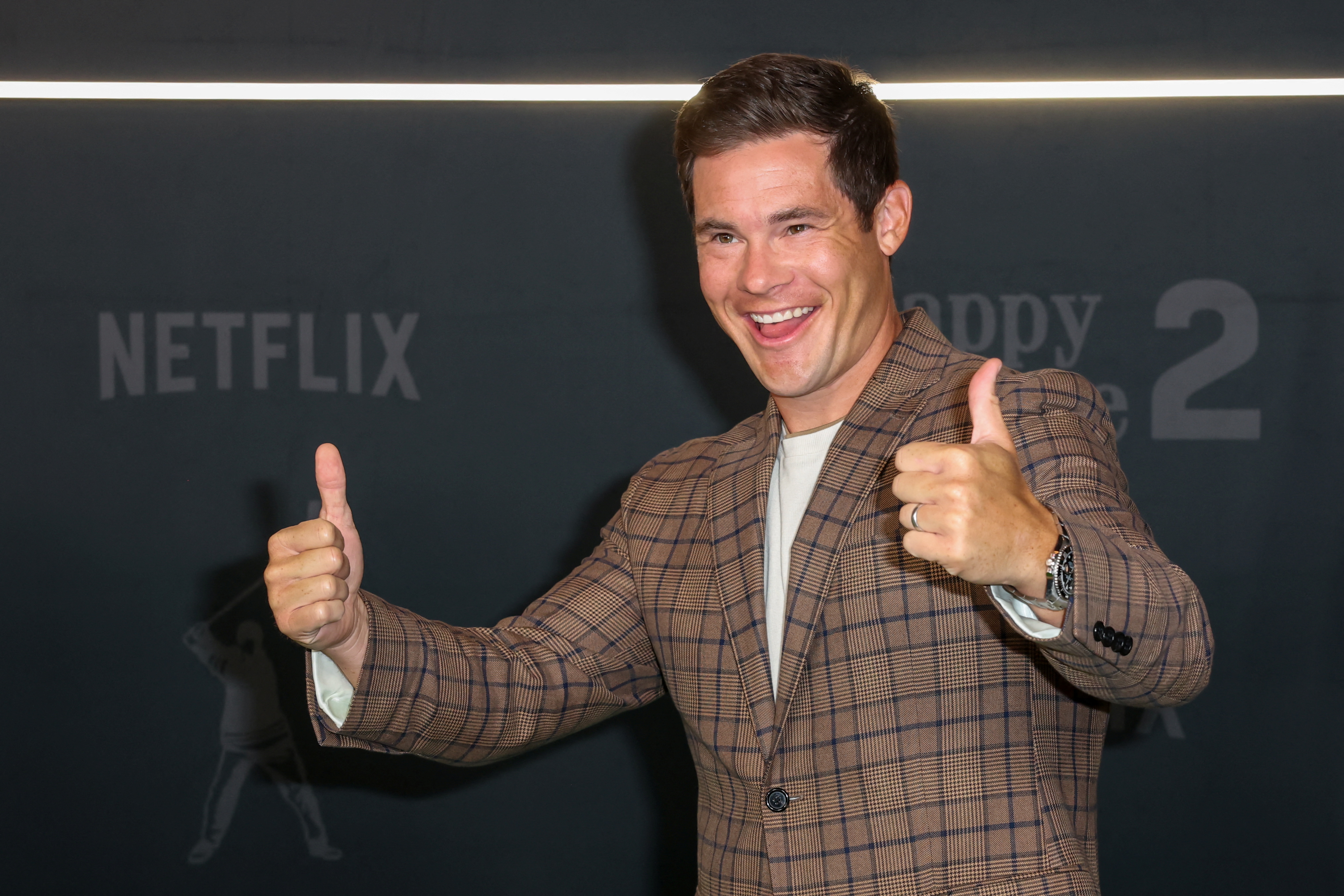 Adam Devine attends a premiere as we look at a new ad for PrizePicks featuring the actor and Marshawn Lynch