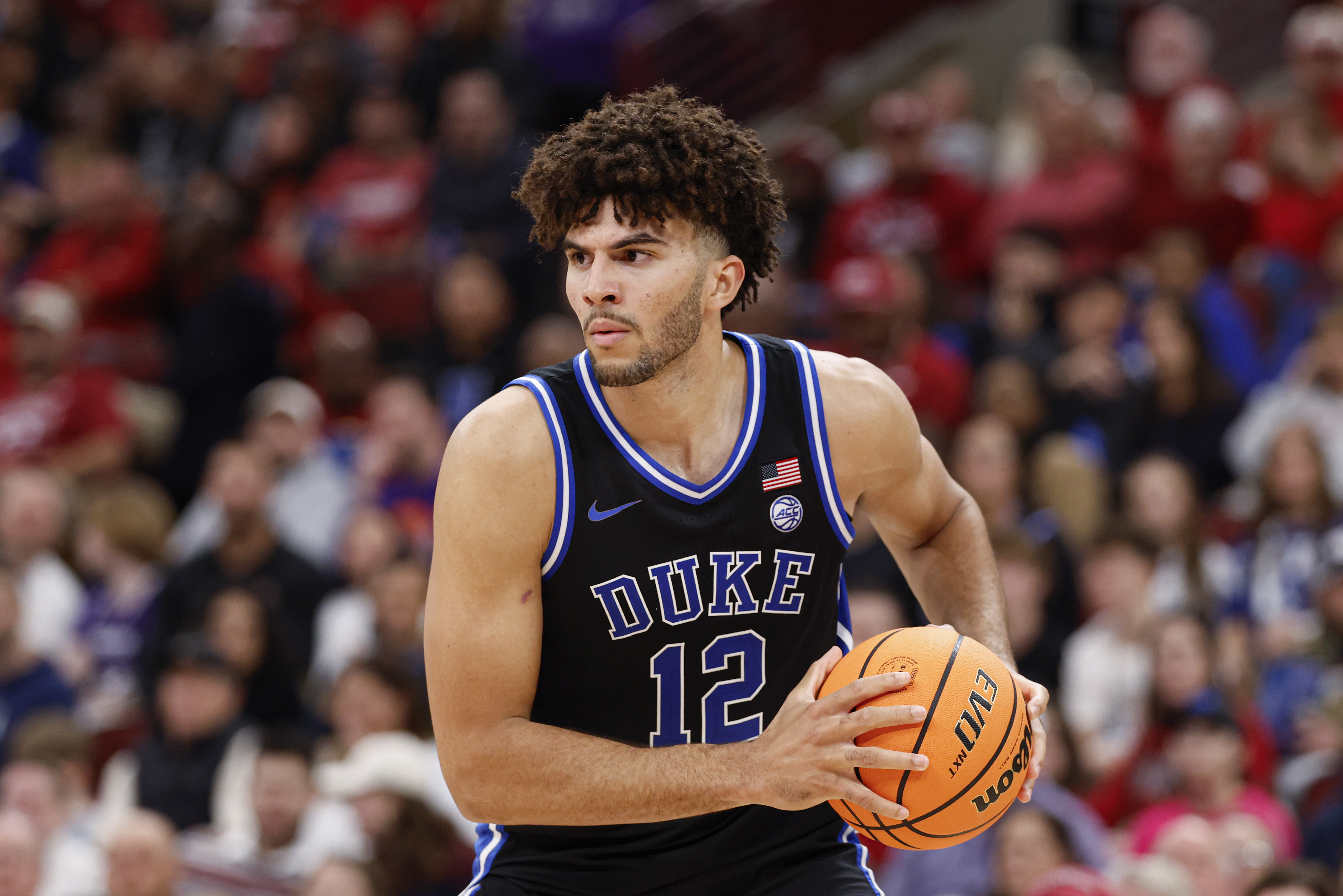 Duke Blue Devils forward Cameron Boozer (12), seen here looking to pass the ball, plays a key role in our Duke vs. Texas Tech predictions.