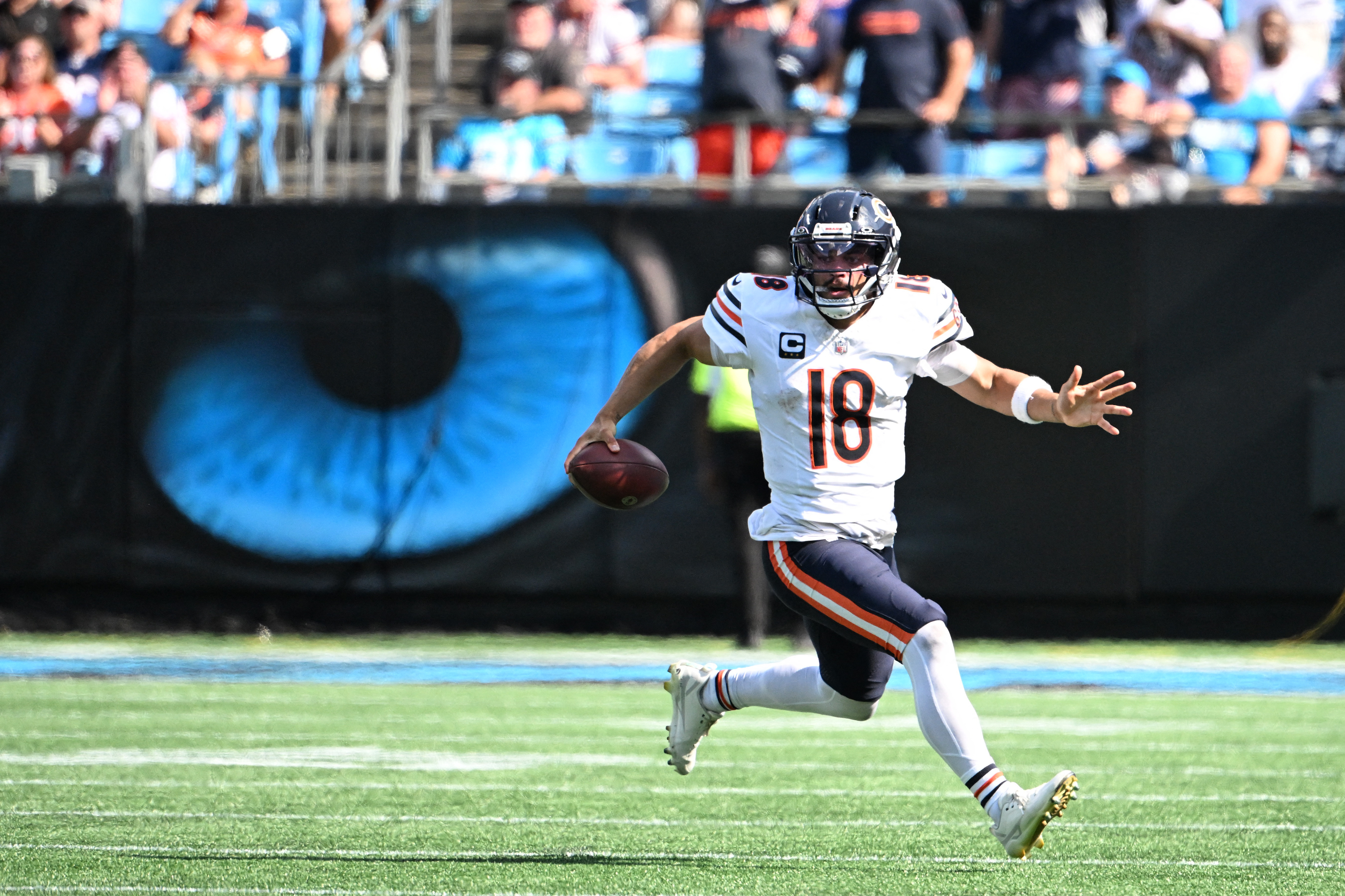 Chicago Bears quarterback Caleb Williams runs with the ball as we make our best NFL player prop predictions for Week 2