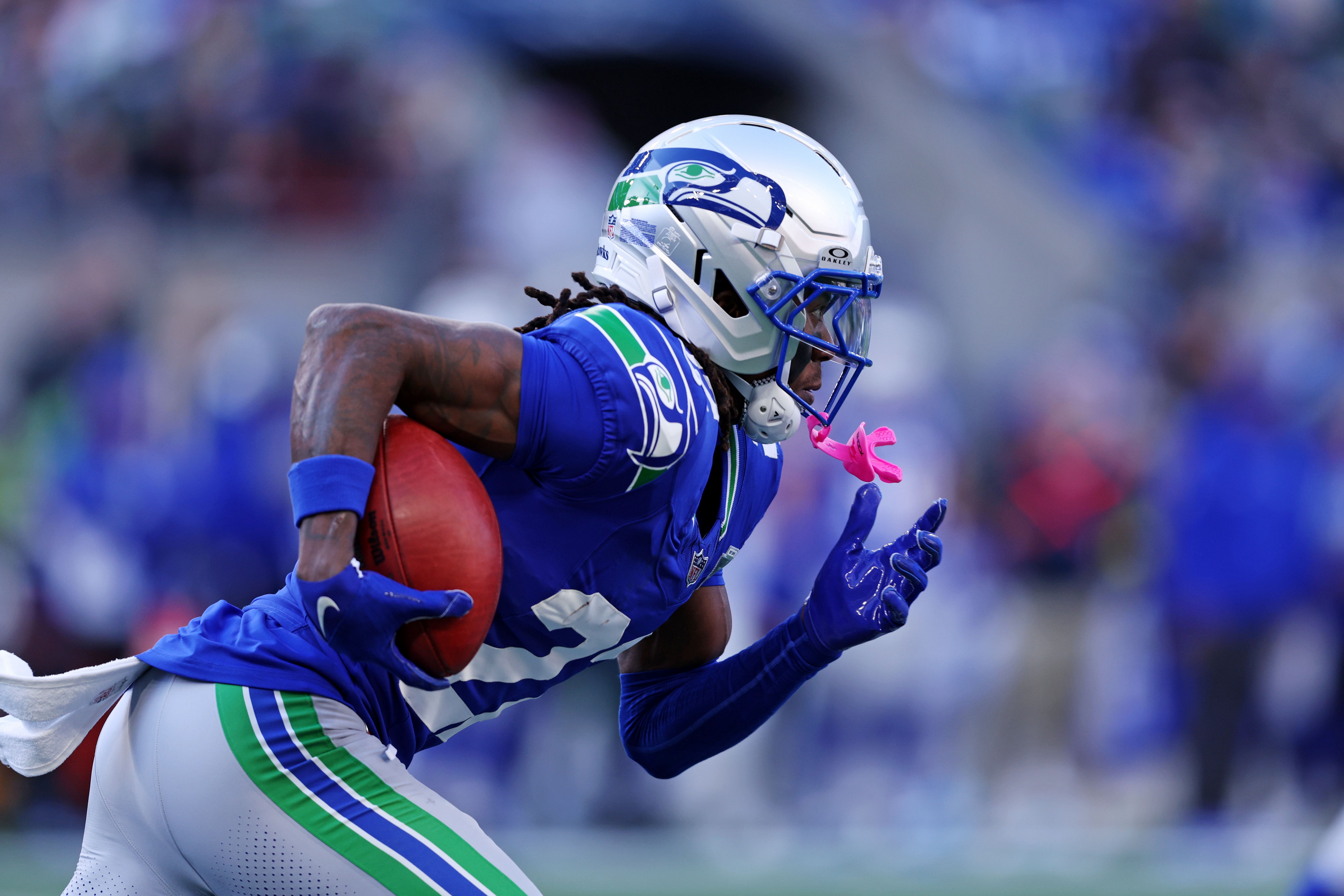 Seattle Seahawks wide receiver Rashid Shaheed (22) runs with the ball as we offer our Seahawks vs. Panthers player props.