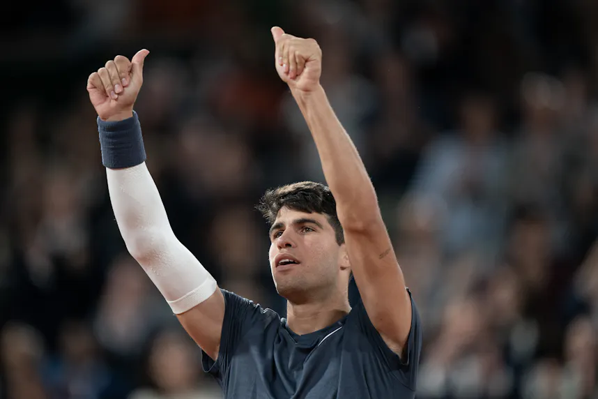 Carlos Alcaraz of Spain celebrates winning his match as we make our Alcaraz vs. Sinner prediction.