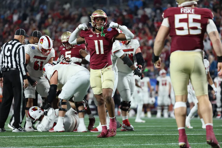 Patrick Payton of the Florida State Seminoles reacts after Braden Fiske sacks Jack Plummer of the Louisville Cardinals during ACC Championship. Florida State opened as the favorites by the 2024 ACC Championship Odds.