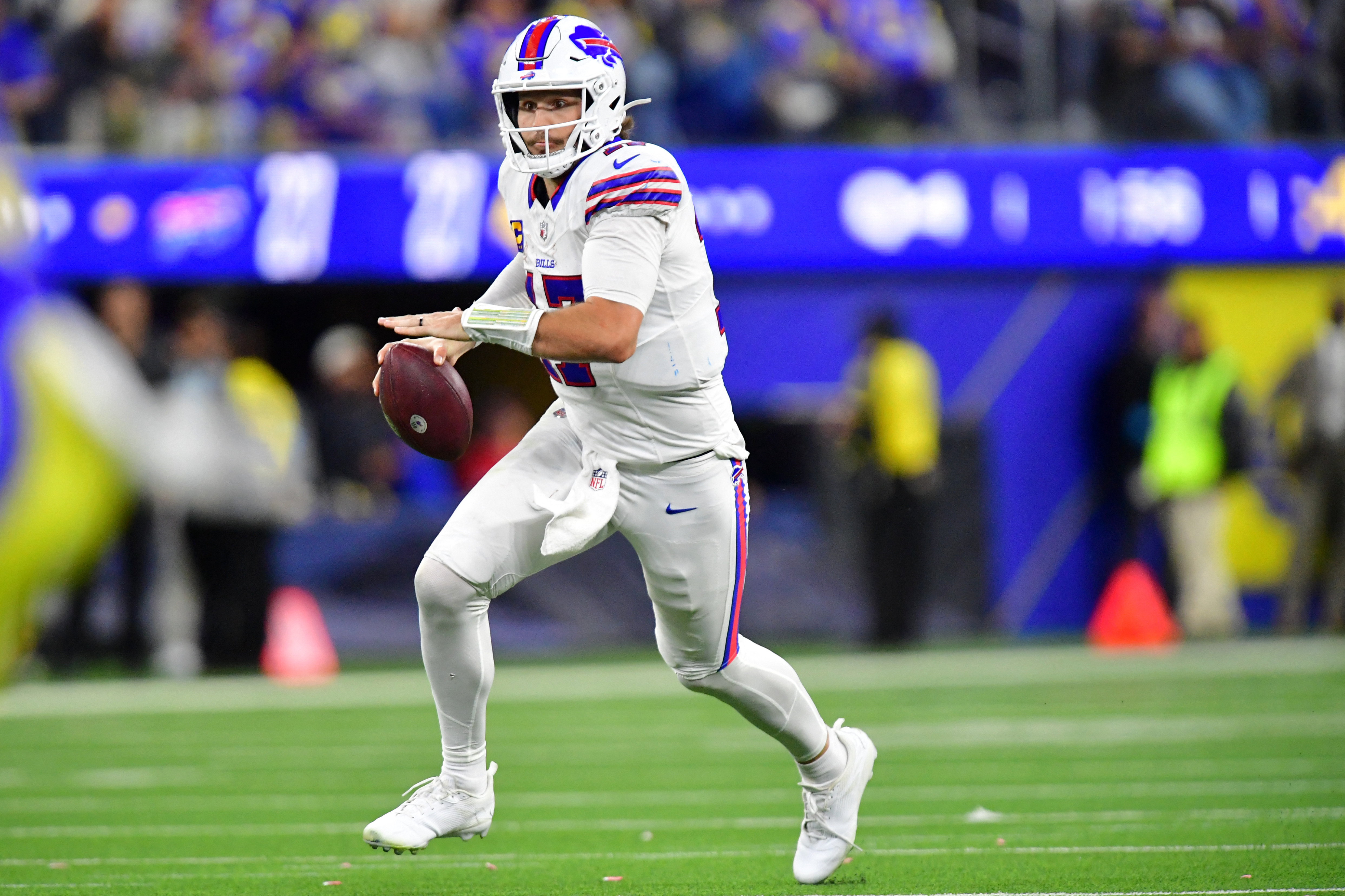 Buffalo Bills quarterback Josh Allen (17) scrambles during the fourth quarter against the Los Angeles Rams as we take a closer look at the 2026-2027 NFL MVP odds.