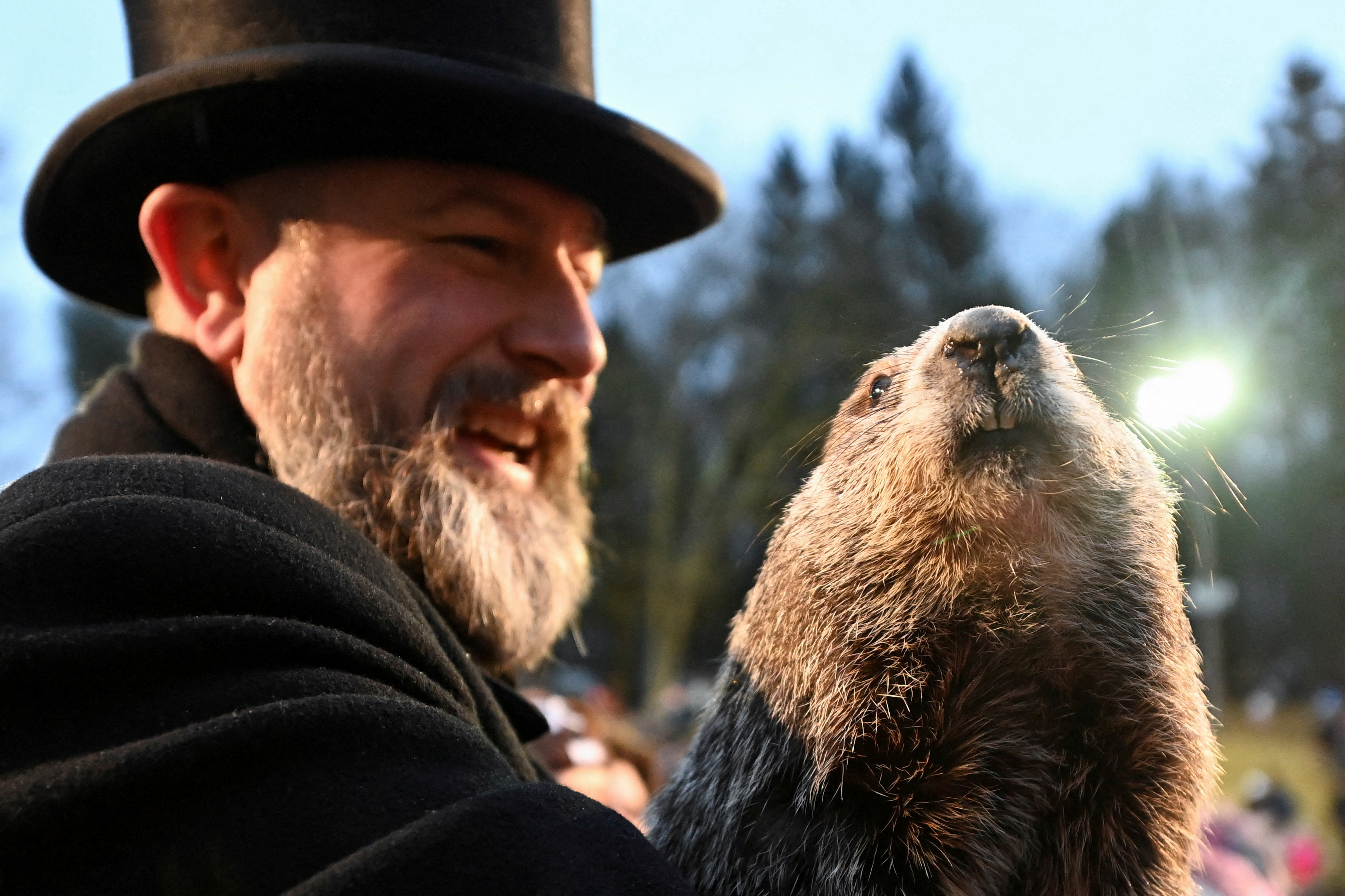 AJ Dereume holds Punxsutawney Phil during the Groundhog Day Festivities as we offer our Groundhog Day prediction.