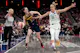 Caitlin Clark (22) of the Indiana Fever dribbles the ball while being fouled by Leonie Fiebich (13) of the New York Liberty, as we offer our best Fever vs. Liberty predictions for Saturday's game at Barclays Center in Brooklyn, N.Y.
