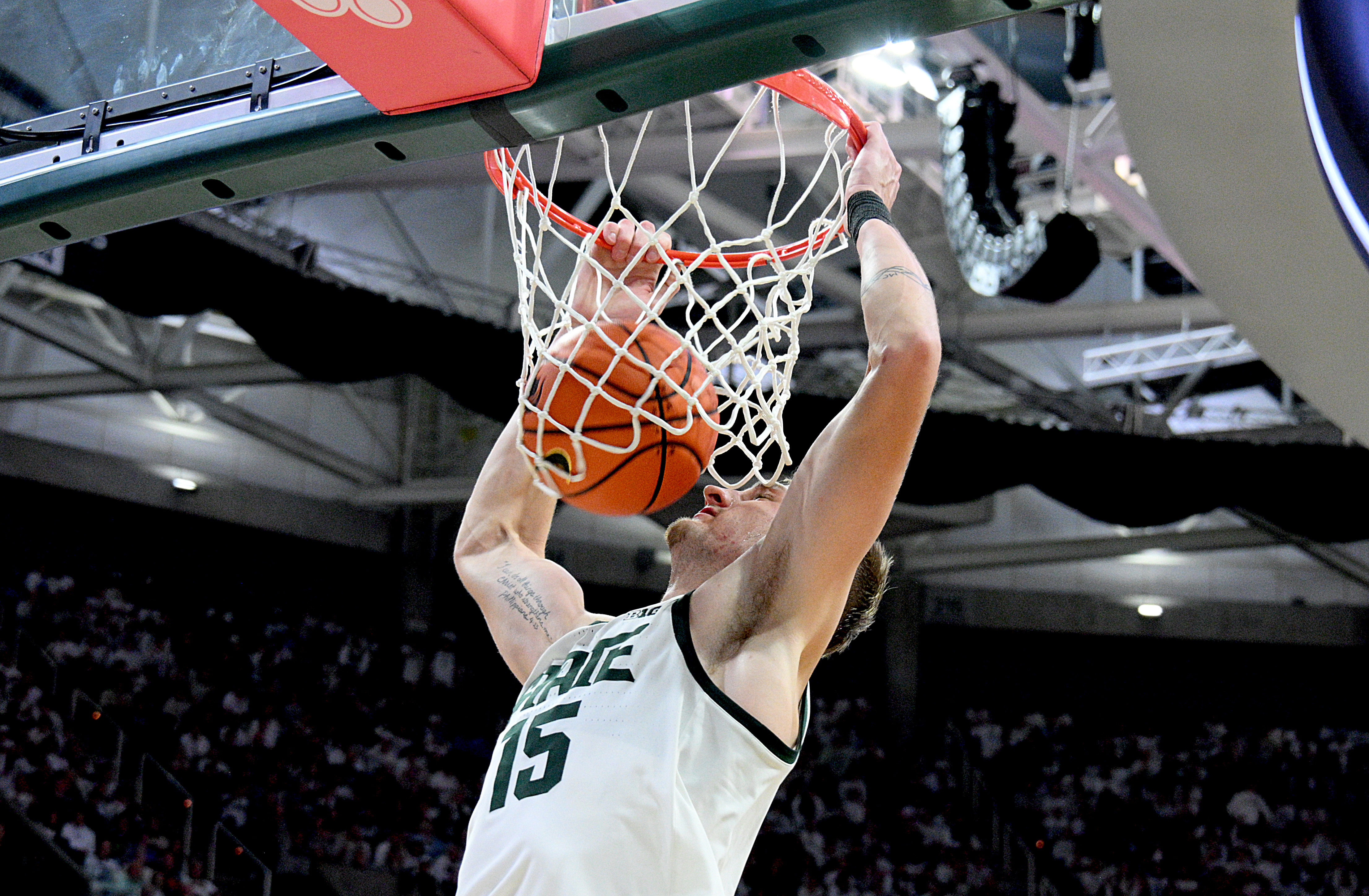 Michigan State Spartans center Carson Cooper dunks as we make our best Ohio State vs. Michigan State prediction.