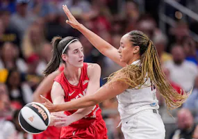 Indiana Fever guard Caitlin Clark (22) passes the ball against Atlanta Dream guard Haley Jones (13), as we offer our best Fever vs. Dream prediction and expert picks for Friday's WNBA matchup at State Farm Arena in Atlanta.