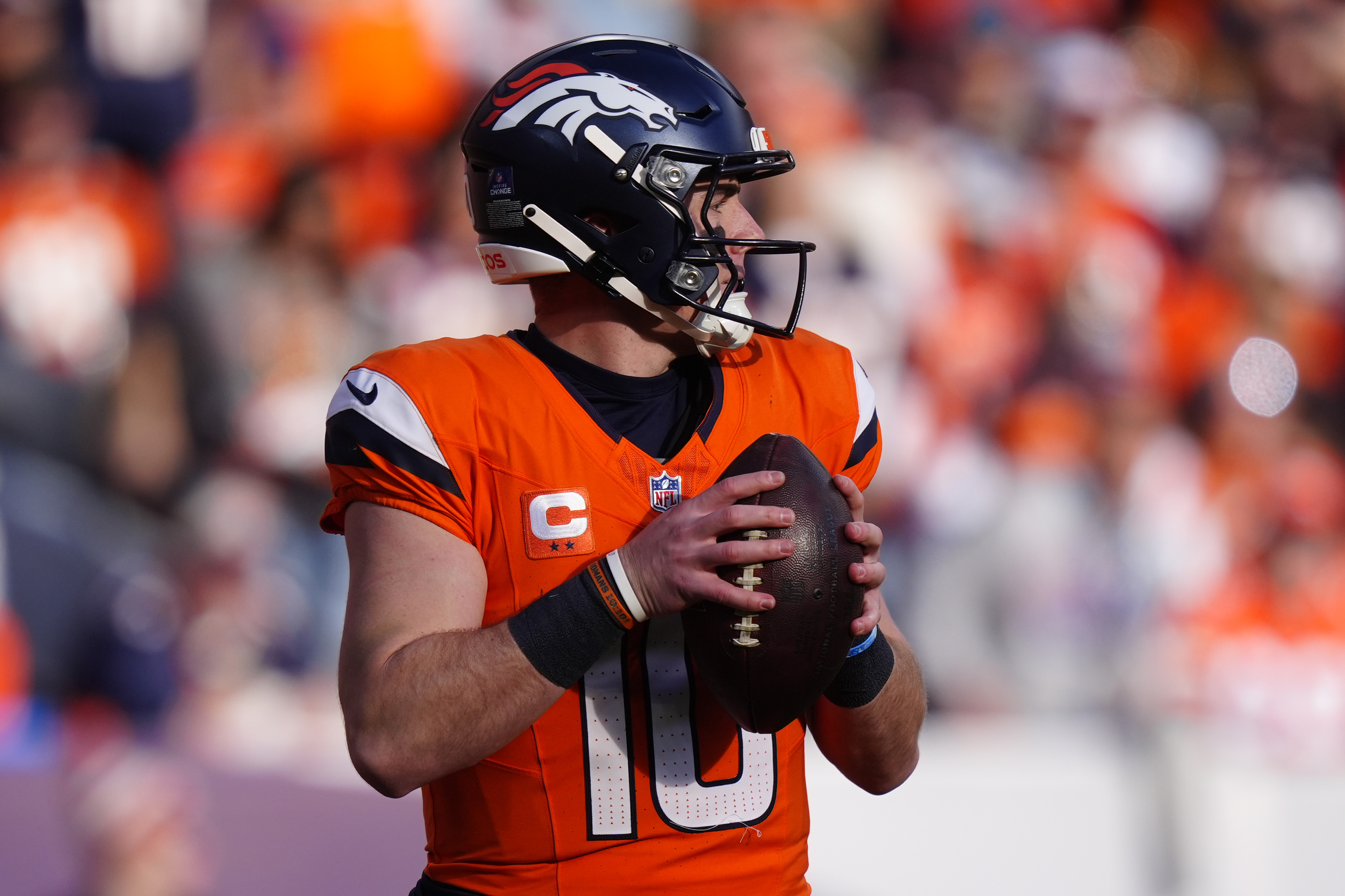 Denver Broncos quarterback Bo Nix (10) drops back to pass as he is featured in our NFL predictions for Week 17.