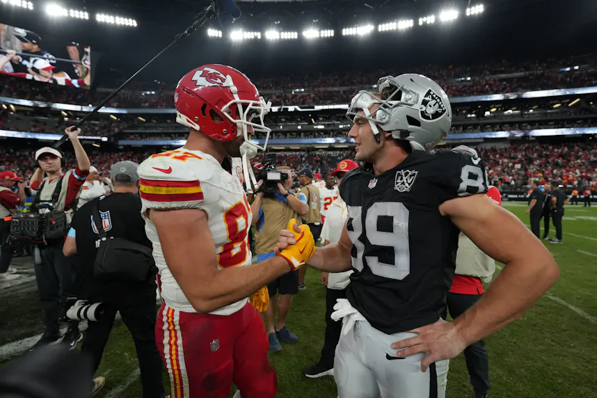 Kansas City Chiefs tight end Travis Kelce and Las Vegas Raiders tight end Brock Bowers interact after the game at Allegiant Stadium as we look at our Raiders vs. Chiefs prediction.