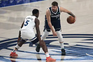 Luka Doncic of the Dallas Mavericks is defended by Anthony Edwards of the Minnesota Timberwolves during Game 4 of the Western Conference Finals. We're backing Doncic in our Mavericks vs. Timberwolves Player Props. 