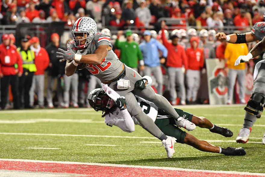 TreVeyon Henderson #32 of the Ohio State Buckeyes scores a touchdown as we look at our Ohio State vs. Michigan prediction