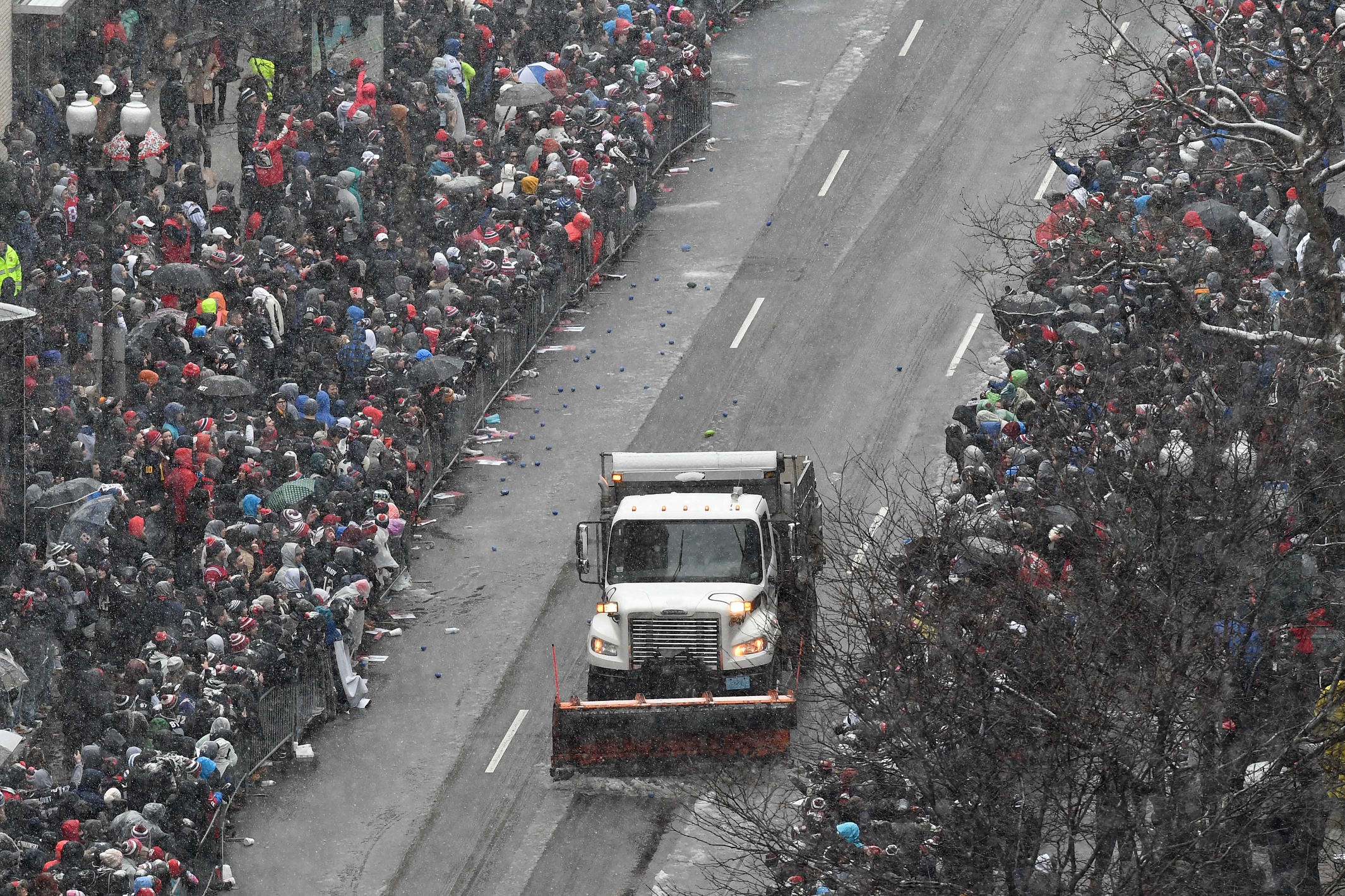 A snowplow clears snow on Boylston Street before the Super Bowl LI parade for the New England Patriots, all as we look at the White Christmas in Boston Prediction Market