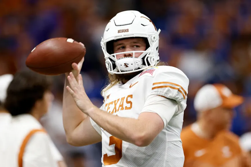 Quinn Ewers of the Texas Longhorns warms up before the Valero Alamo Bowl as we look at our Texas-Alabama Draftkings promo code.