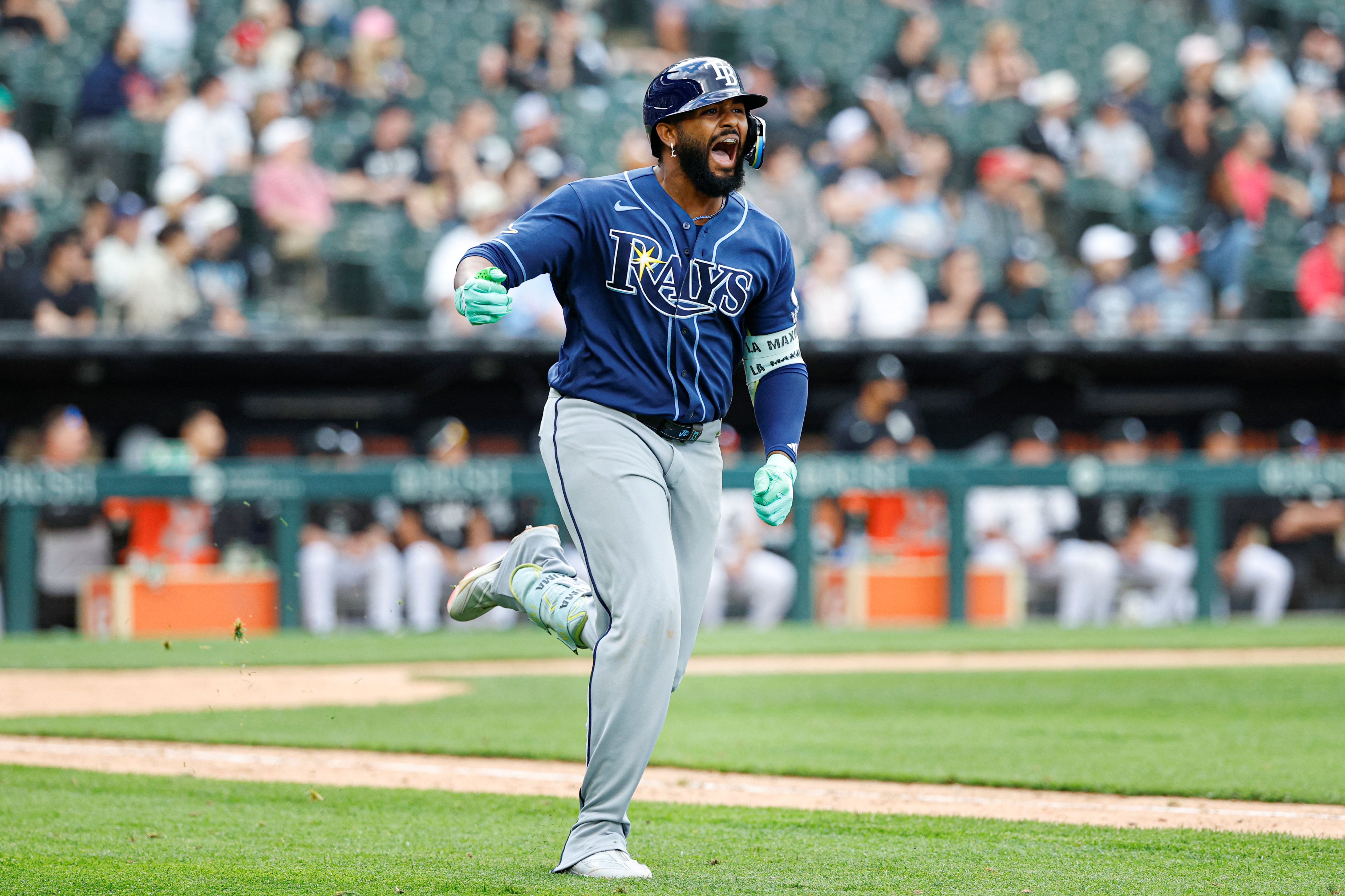 Tampa Bay Rays third baseman Junior Caminero celebrates as he rounds the bases, and he's key as we look at our home run predictions today.