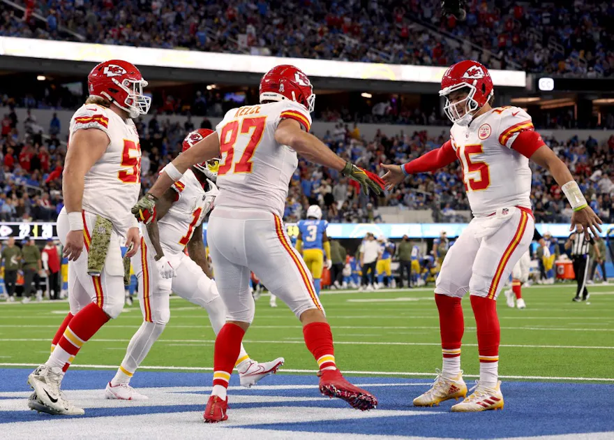 Travis Kelce of the Kansas City Chiefs celebrates his touchdown catch with Patrick Mahomes and Creed Humphrey against the Los Angeles Chargers.