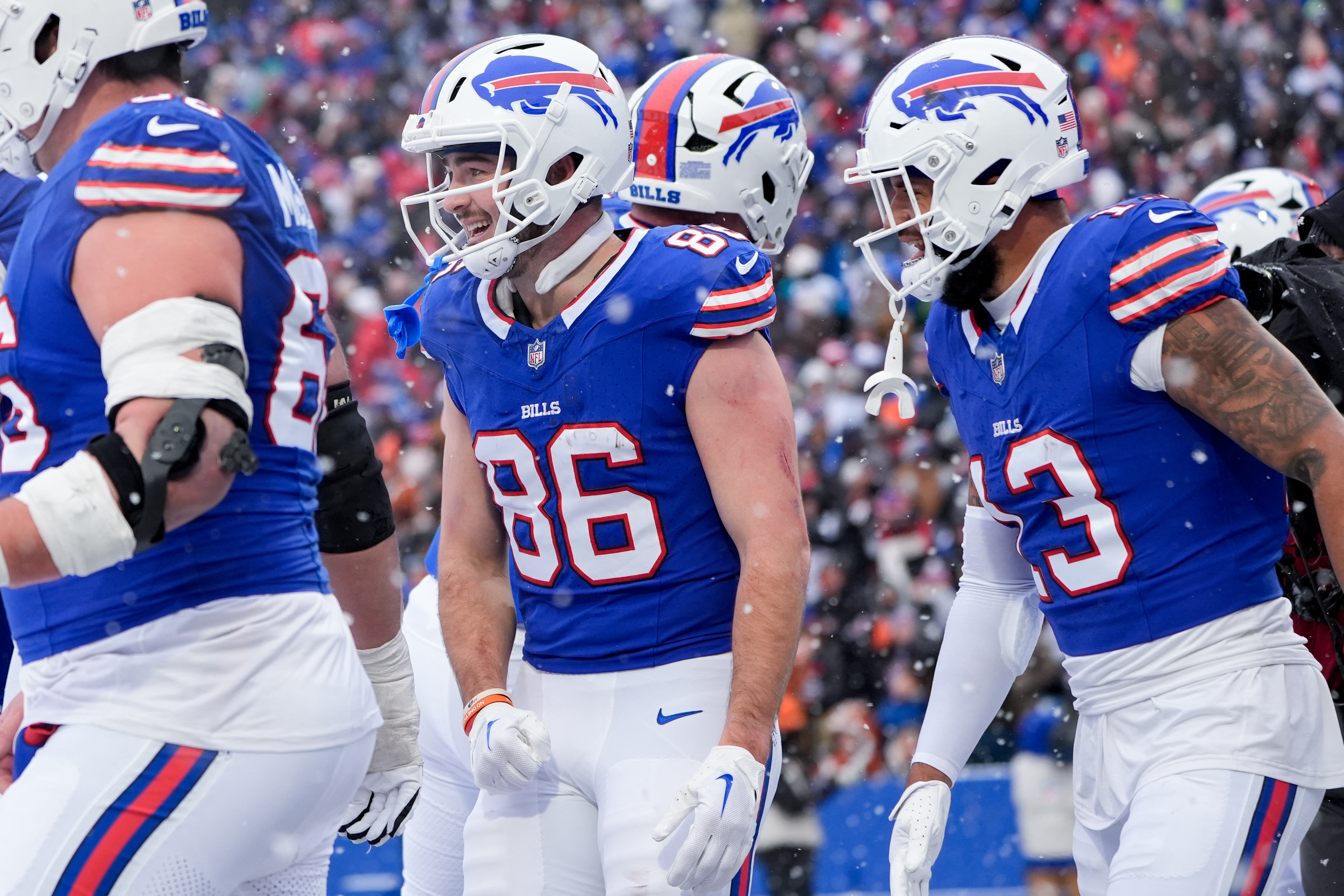 Buffalo Bills tight end Dalton Kincaid (86) celebrates scoring a touchdown as we break down the NFL odds & Divisional Round schedule.