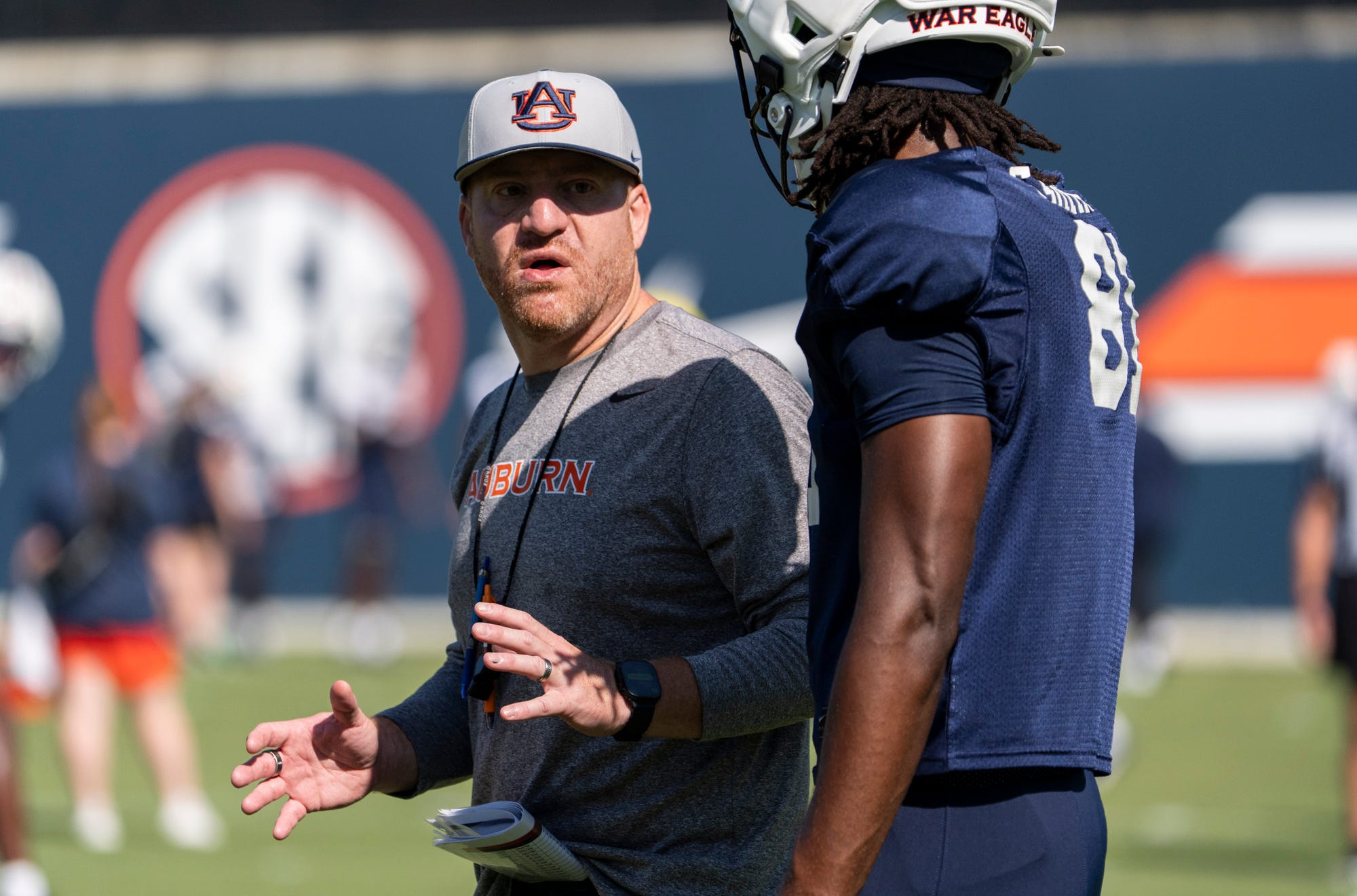  Auburn Tigers head coach Alex Golesh talks with wide receiver Erick Smith as we make our best Baylor vs. Auburn prediction.